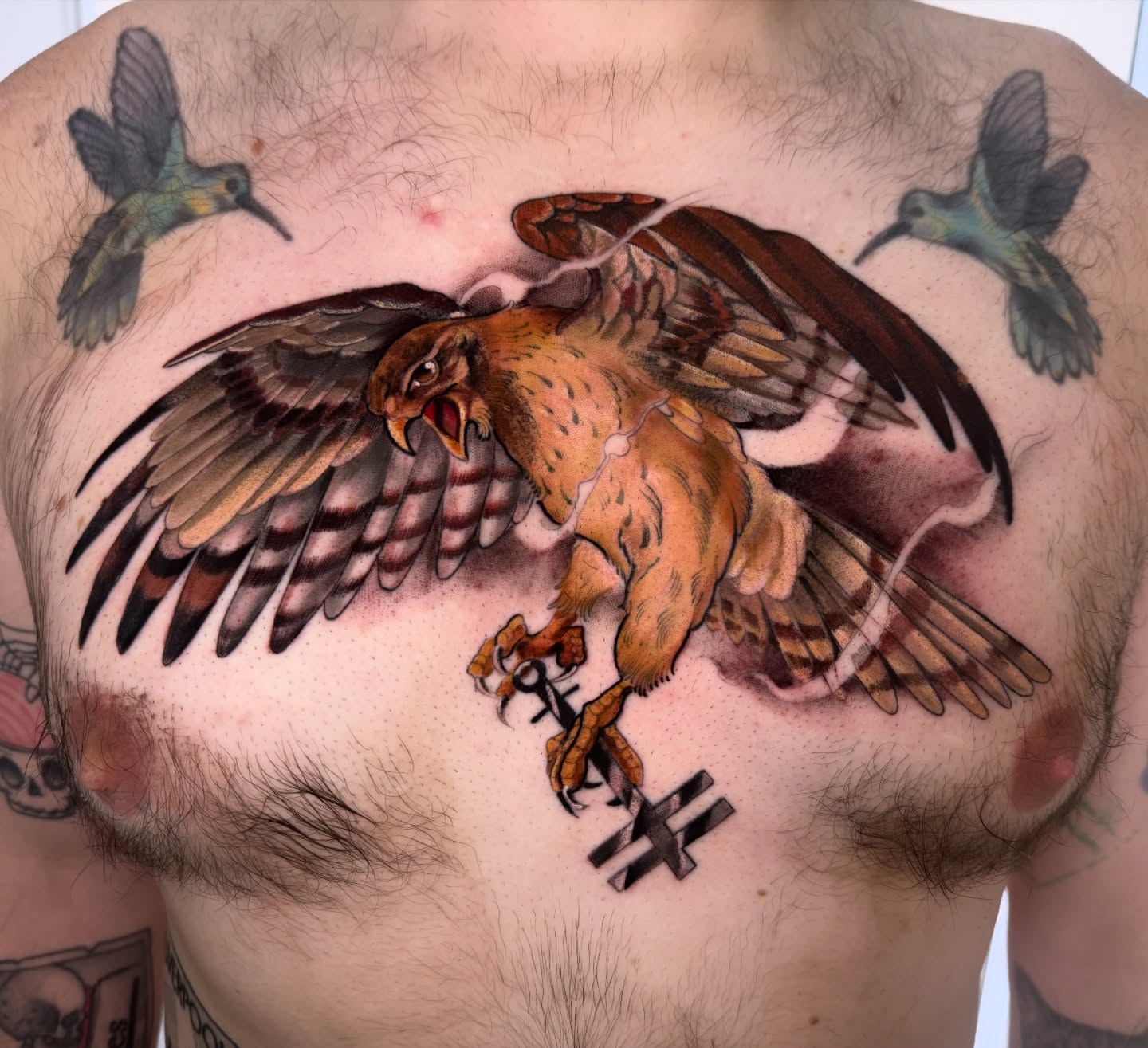 Hawk realism tattoo on the chest by Hannah Mckee