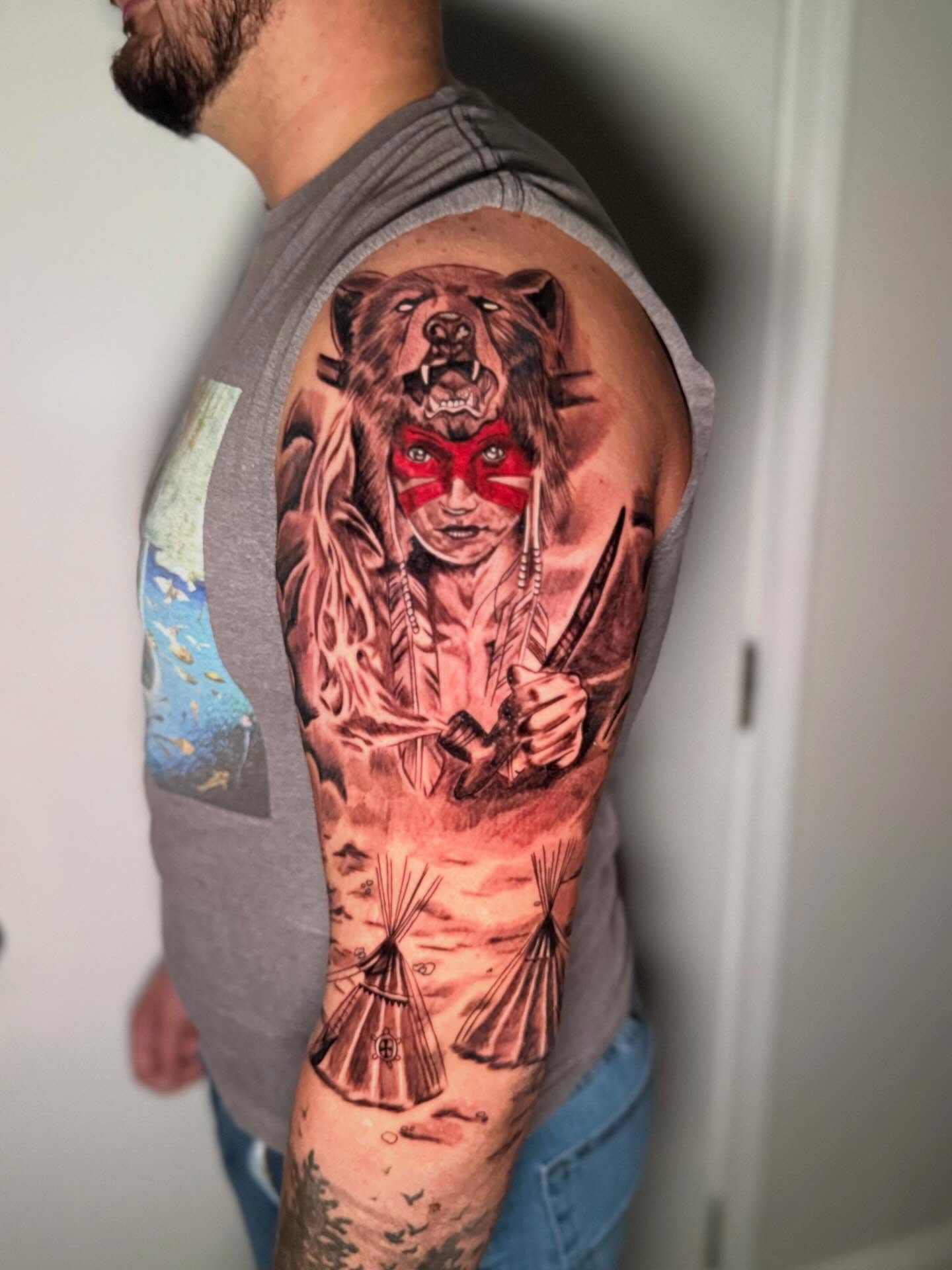 Indian warrior with bear realism tattoo on the upper arm by dotMX