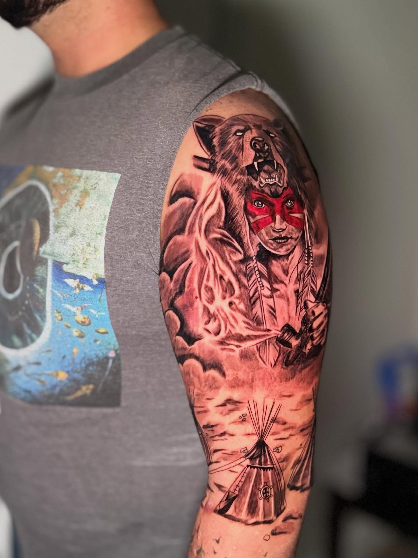 Native american warrior with wolf American traditional tattoo on the upper arm by dotMX