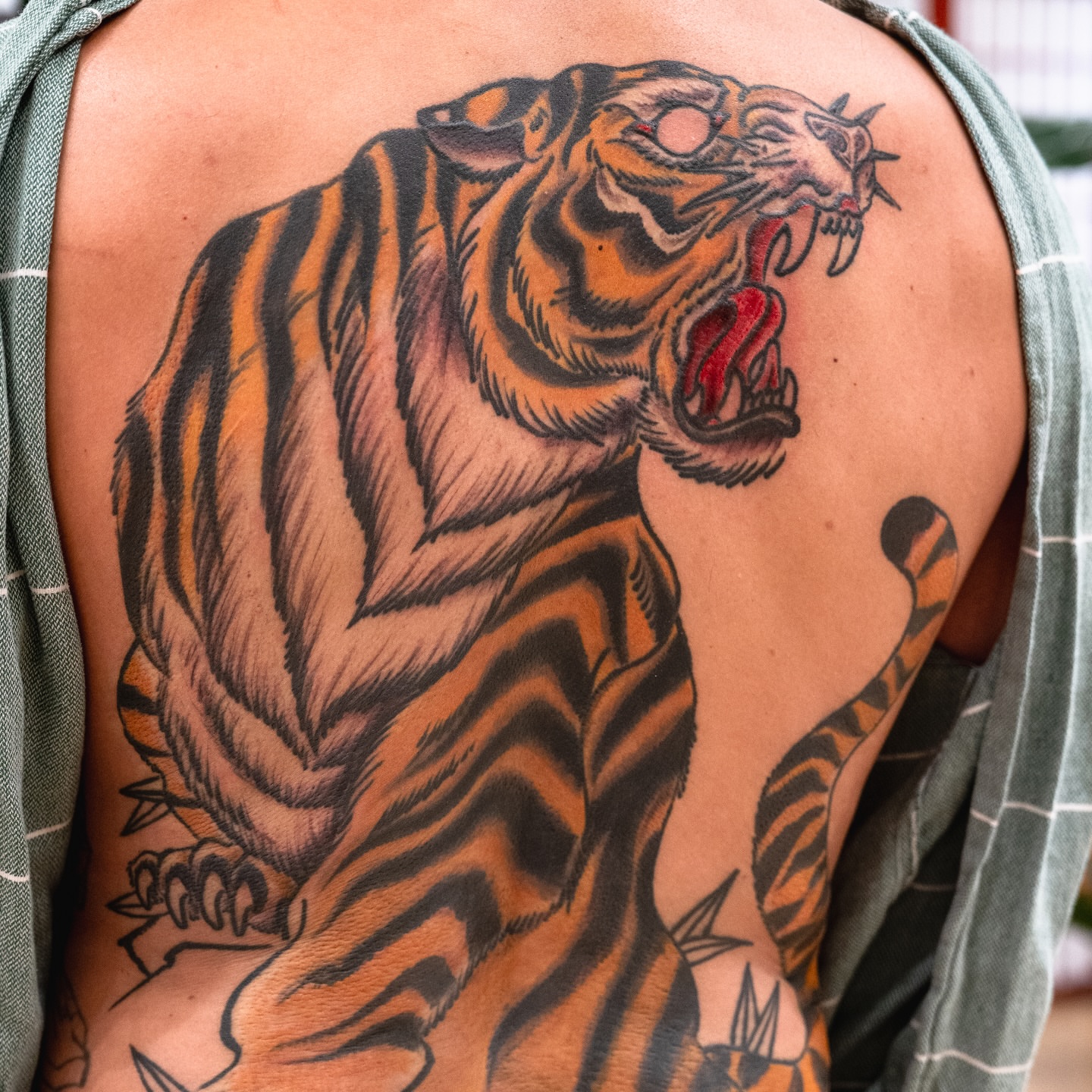 Roaring tiger realism tattoo on the back by James Fernella, San Francisco, California