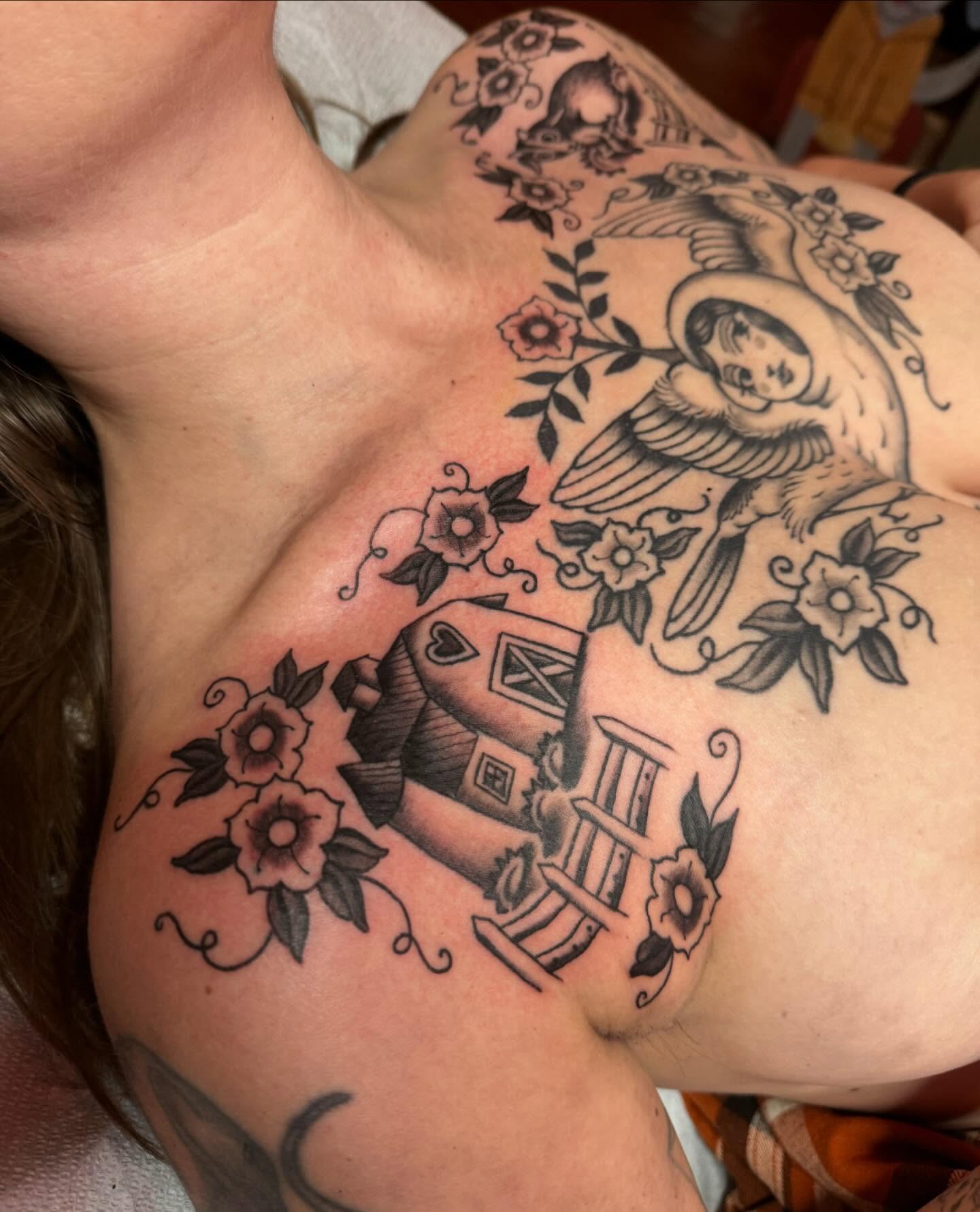 Bird and flowers American traditional tattoo on the shoulder by B