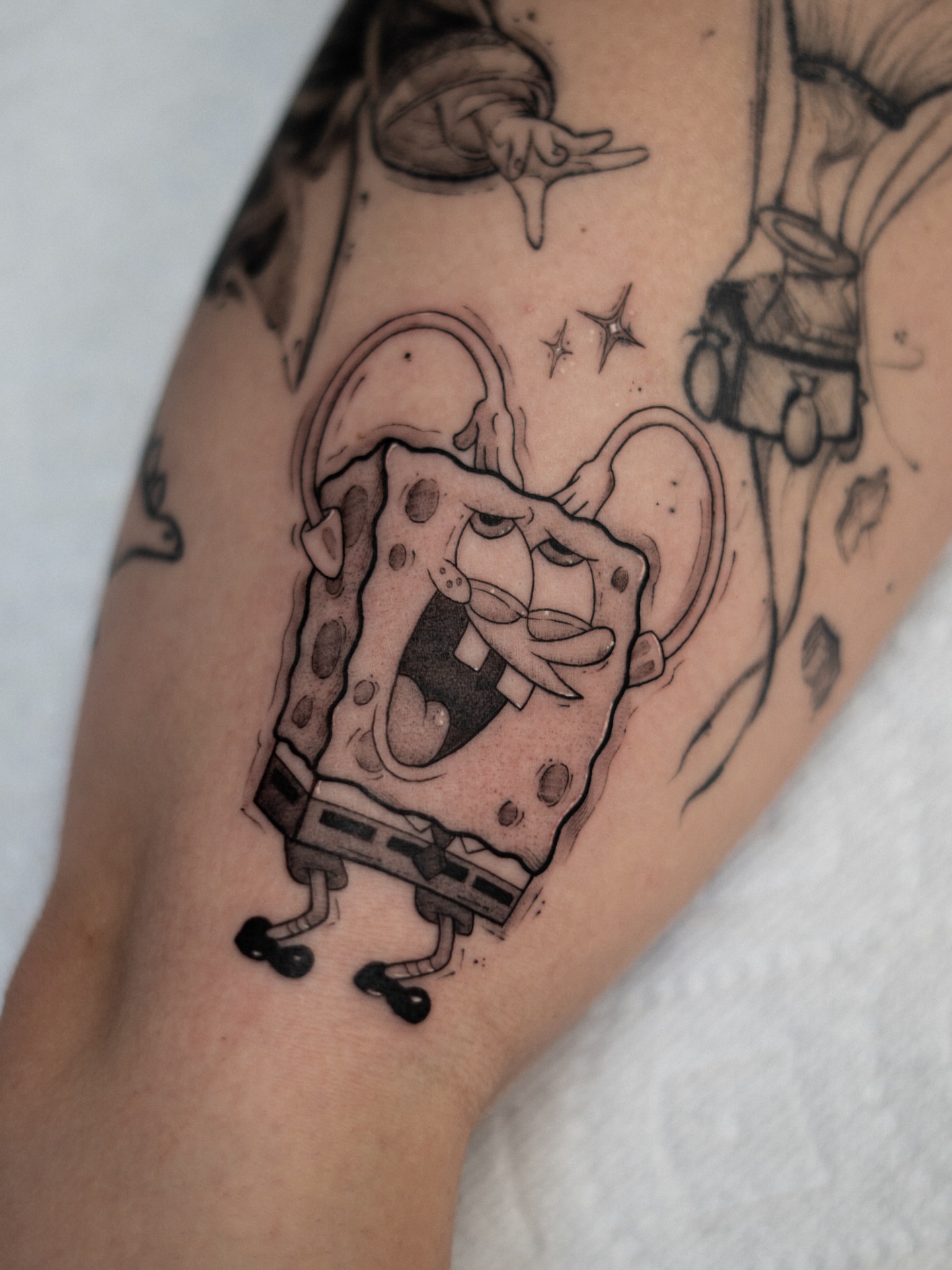 Spongebob squarepants black and grey tattoo on the forearm by Adriano Bassalo