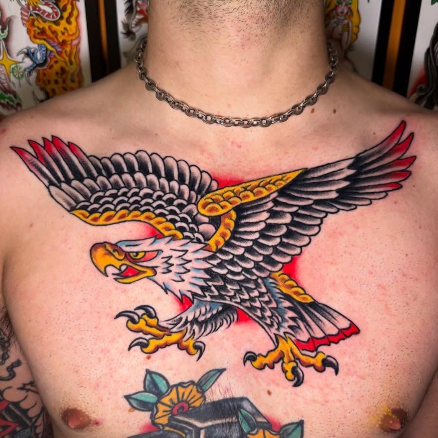 Eagle American traditional tattoo on the chest by Mike Dunn