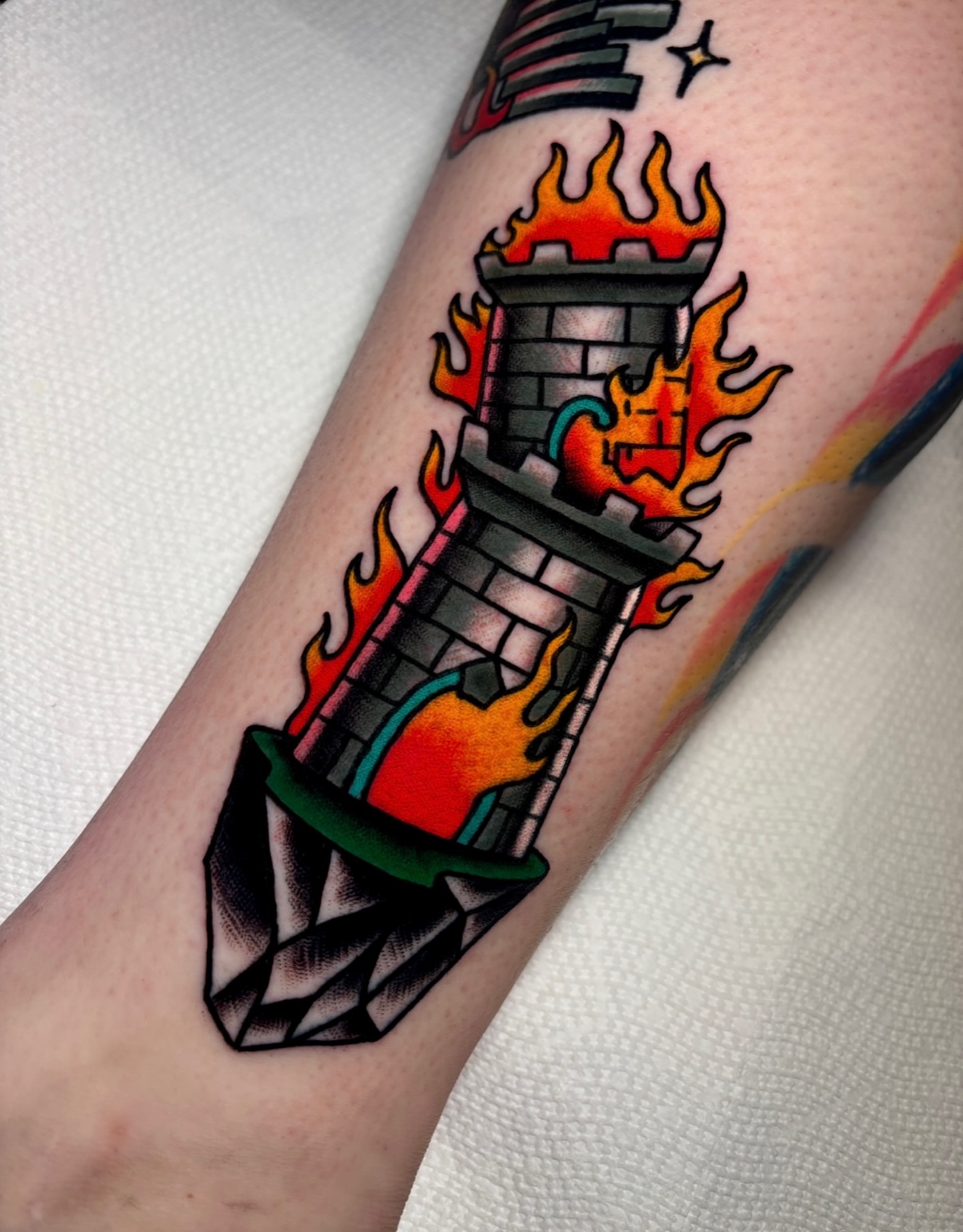 Flame tower American traditional tattoo on the forearm by Mickey Putillo, Charlotte, North Carolina