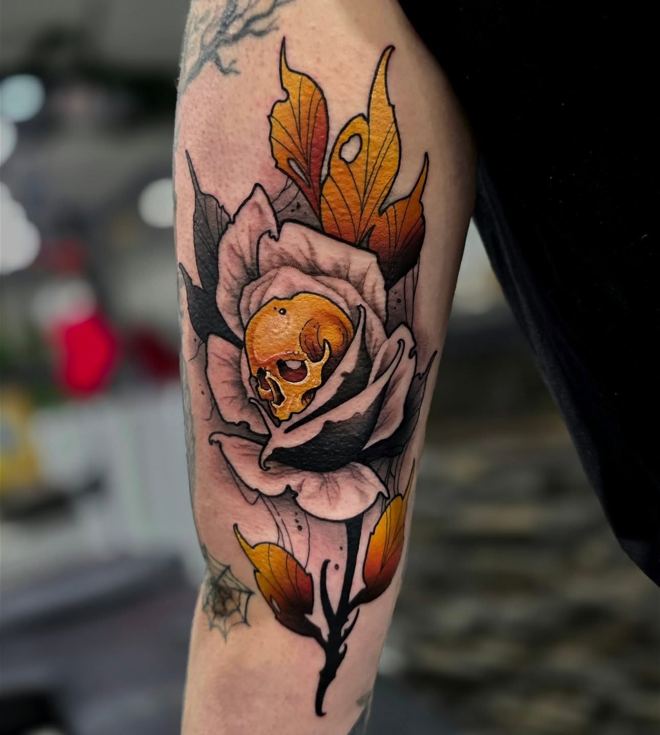 Rose with skull realism tattoo on the forearm by Julia Oravets