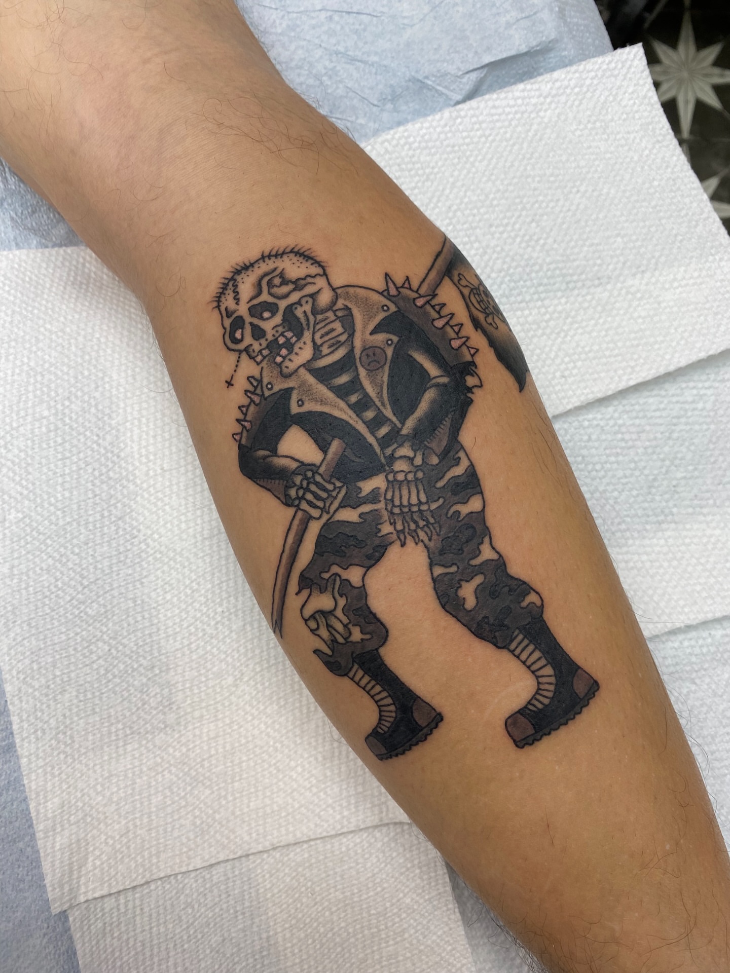 Military skeleton black and grey tattoo on the forearm by Mike Tapia