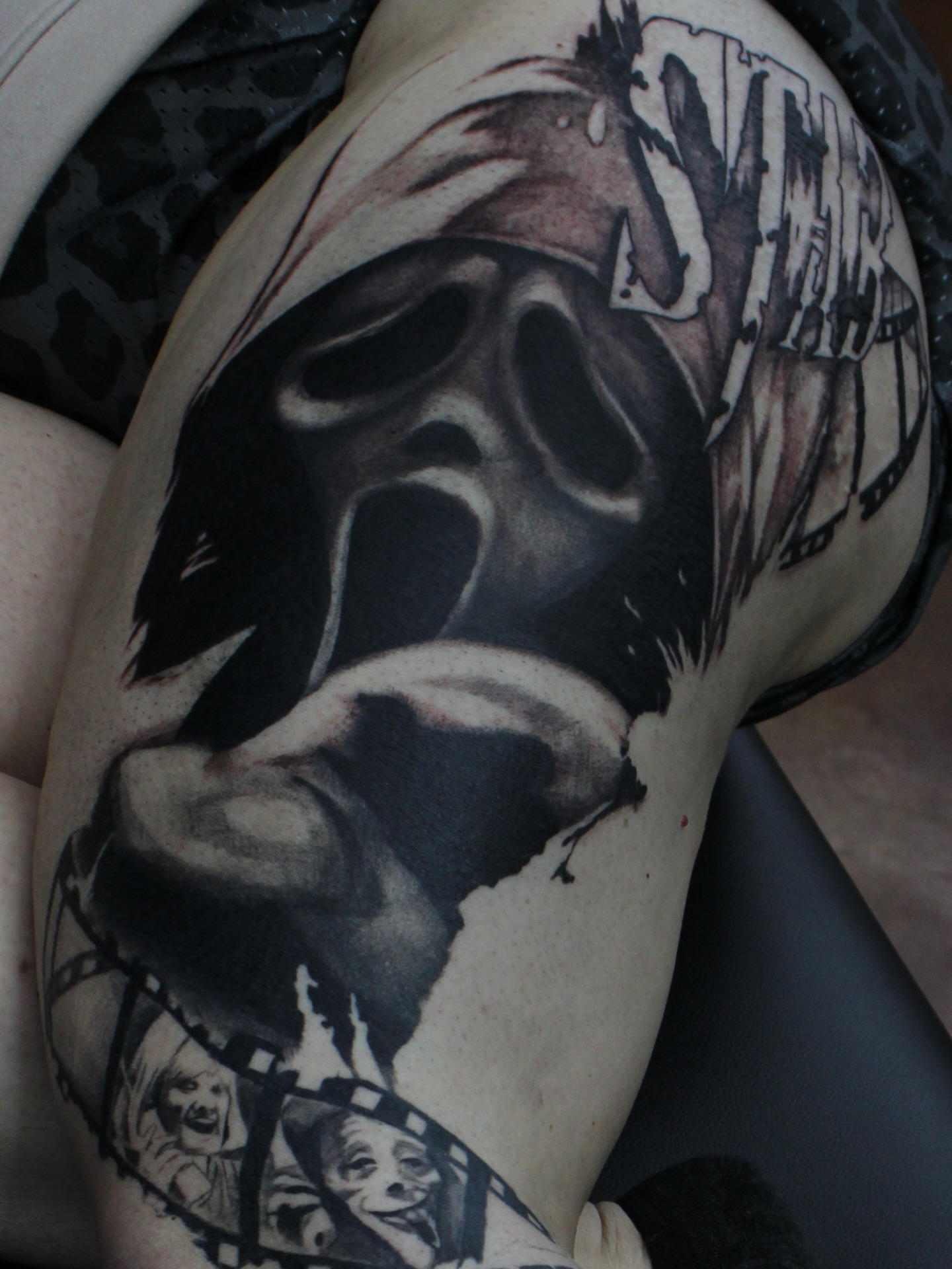 Mask realism tattoo on the thigh by Trent Hebert