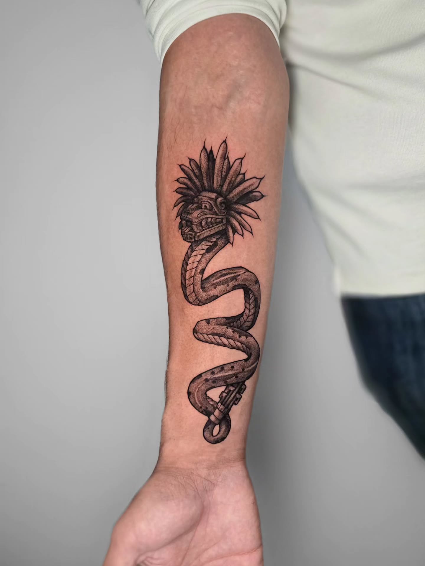 Serpent with headdress black and grey tattoo on the forearm by Ceso732