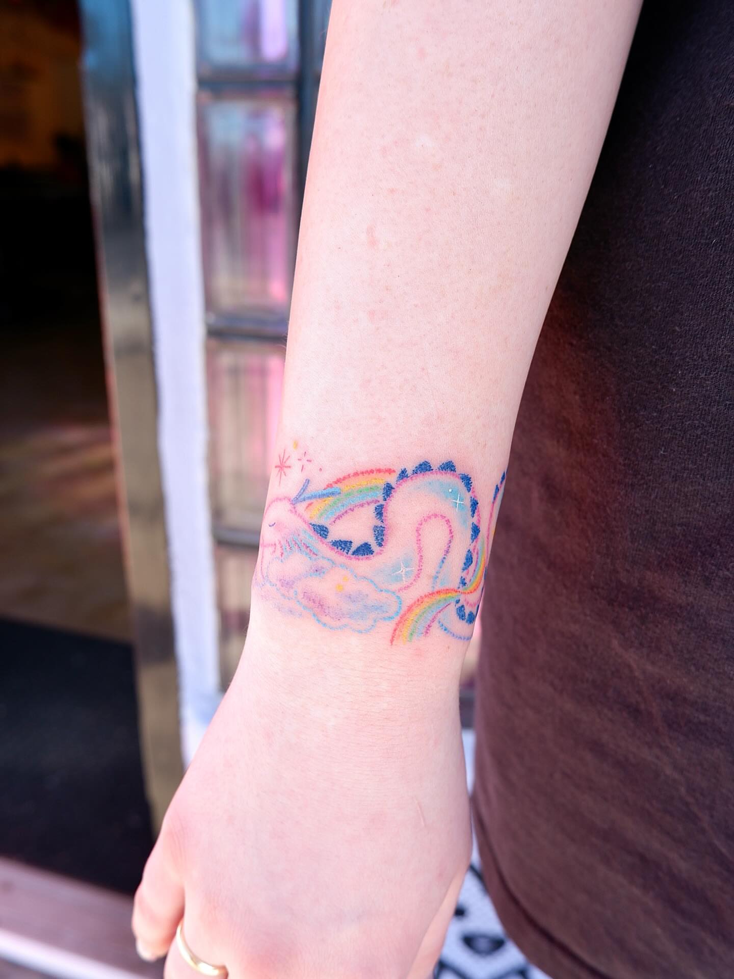 Rainbow unicorn dotwork tattoo on the forearm by 타투 Seon 컬러타투