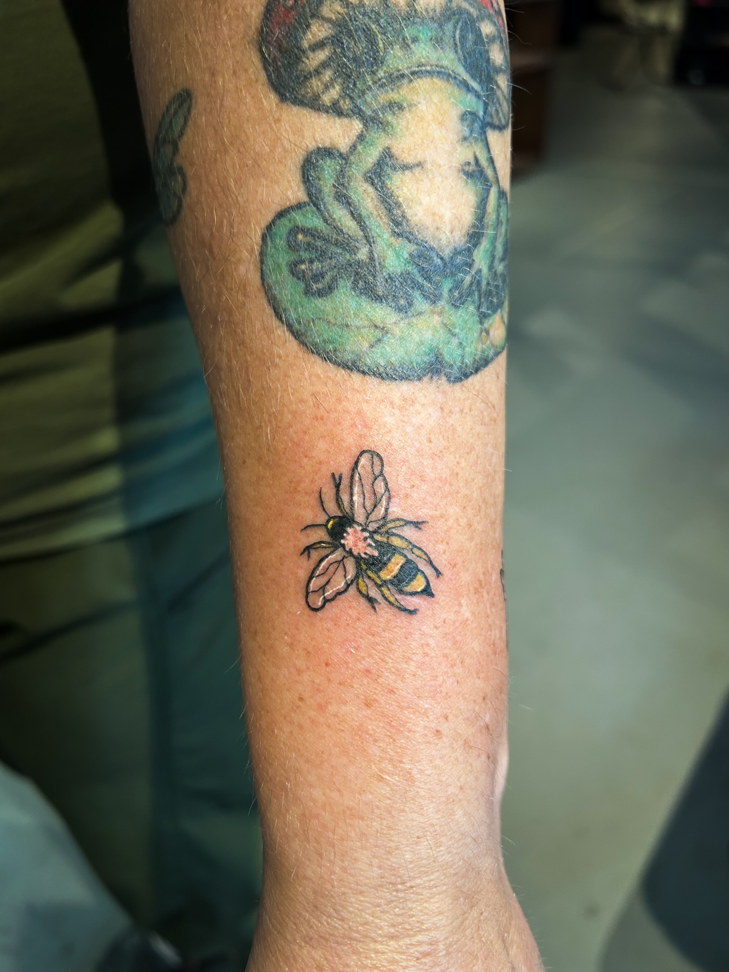 Bee American traditional tattoo on the forearm by @inkspirationtattoo_co