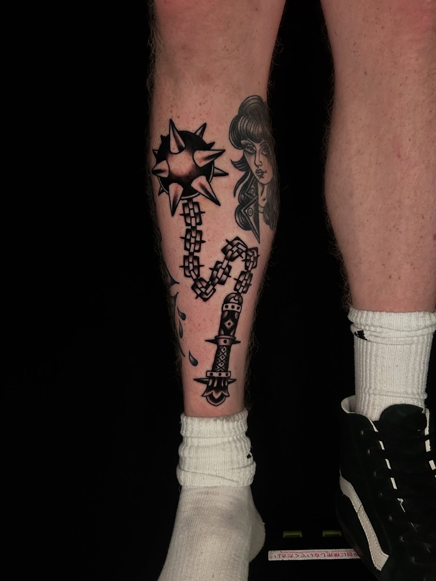 Woman with chain and dagger neo-traditional tattoo on the calf by β π€ππ©π¦π©π’π β± β
