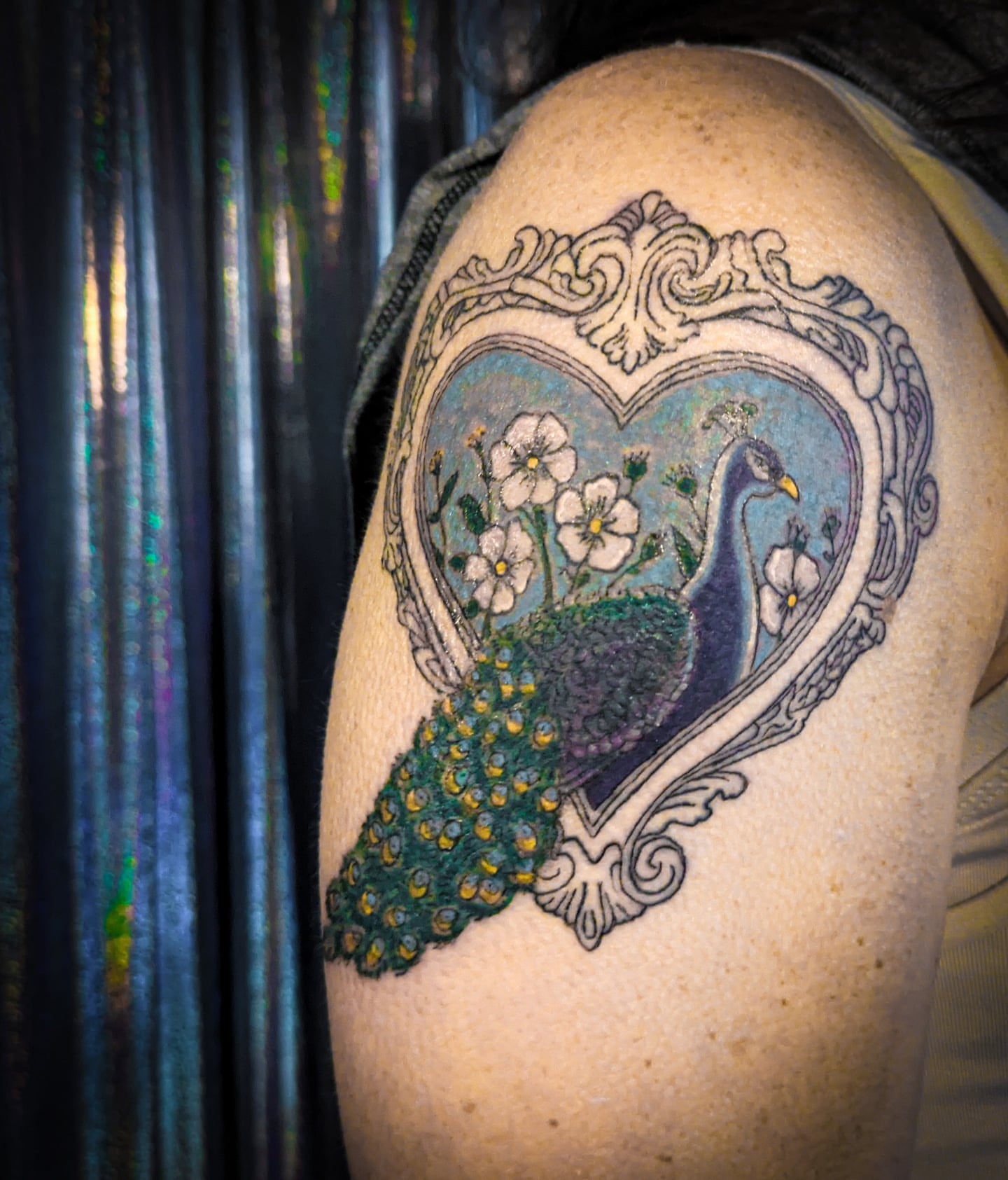 Peacock and floral heart realism tattoo on the shoulder by Miranda Gilvarry - Thin Skin Tattoos, Salt Lake City, Utah