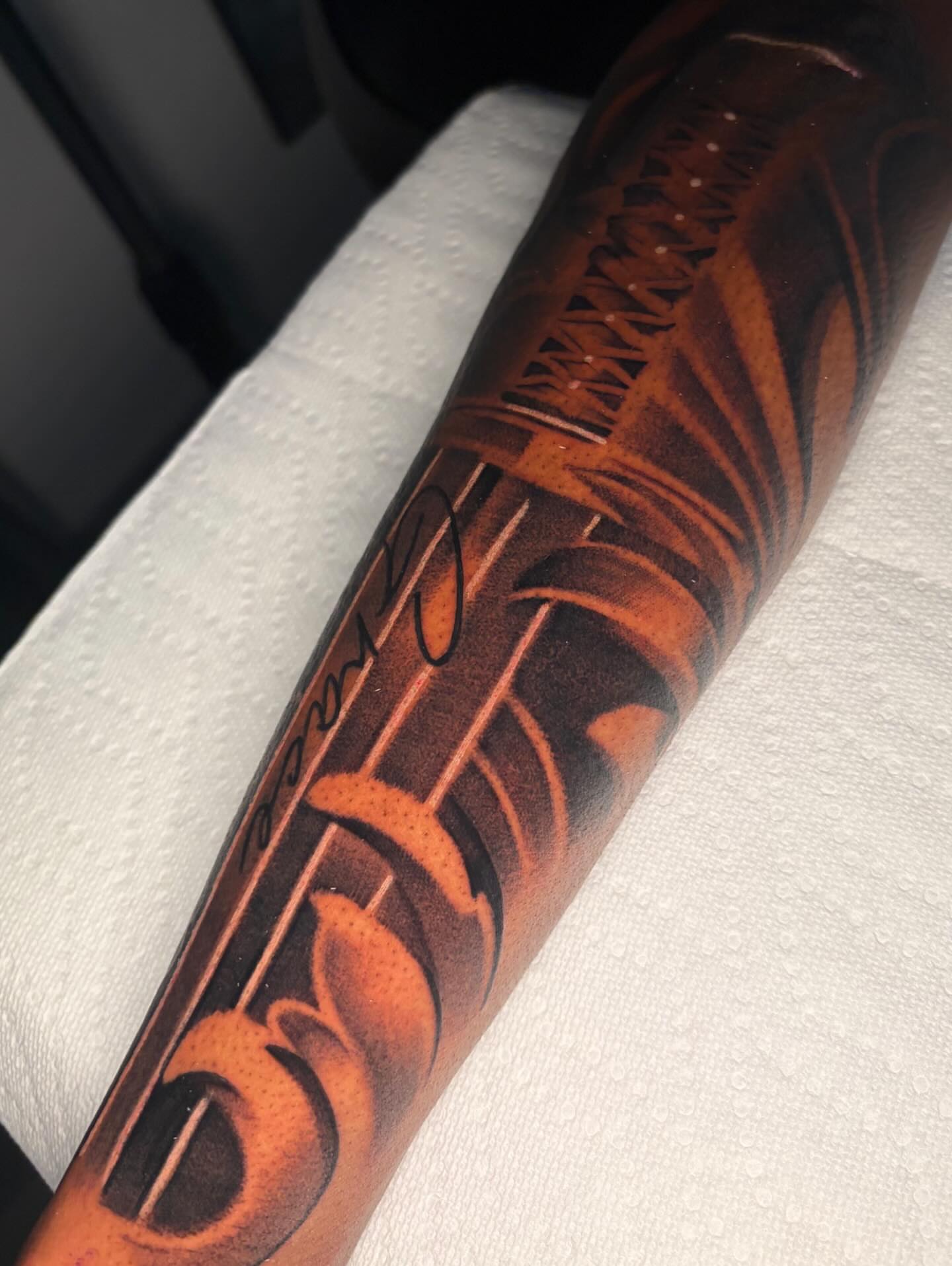 Flames and script geometric tattoo on the forearm by Jaylen - Atlanta Tattoo Artist