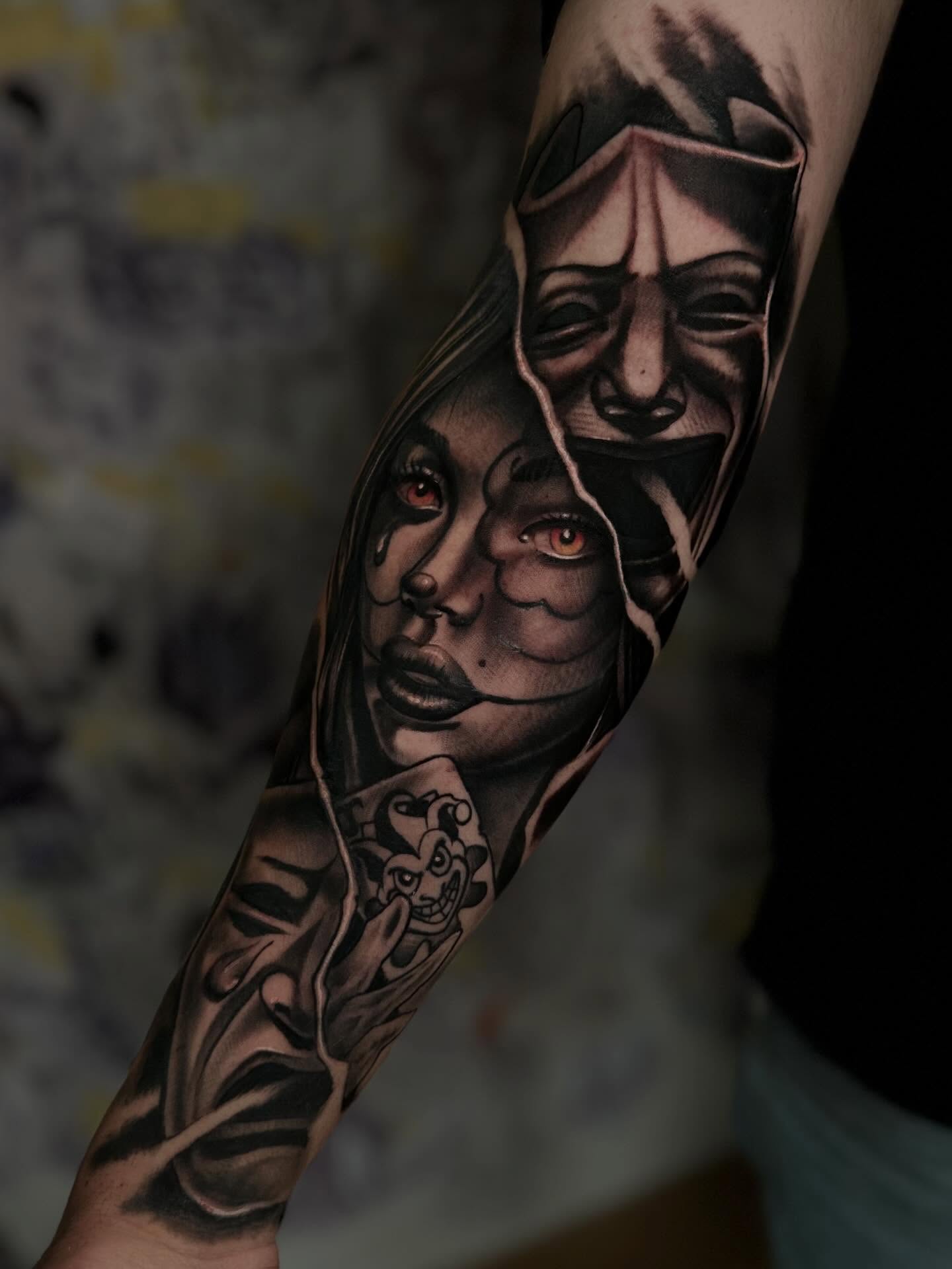 Mask and woman realism tattoo on the forearm by Italo Holie