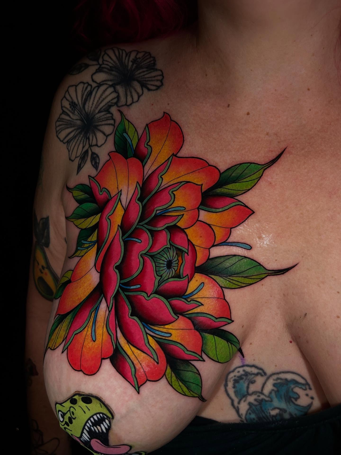 Flower American traditional tattoo on the chest by Lexi Kniskern