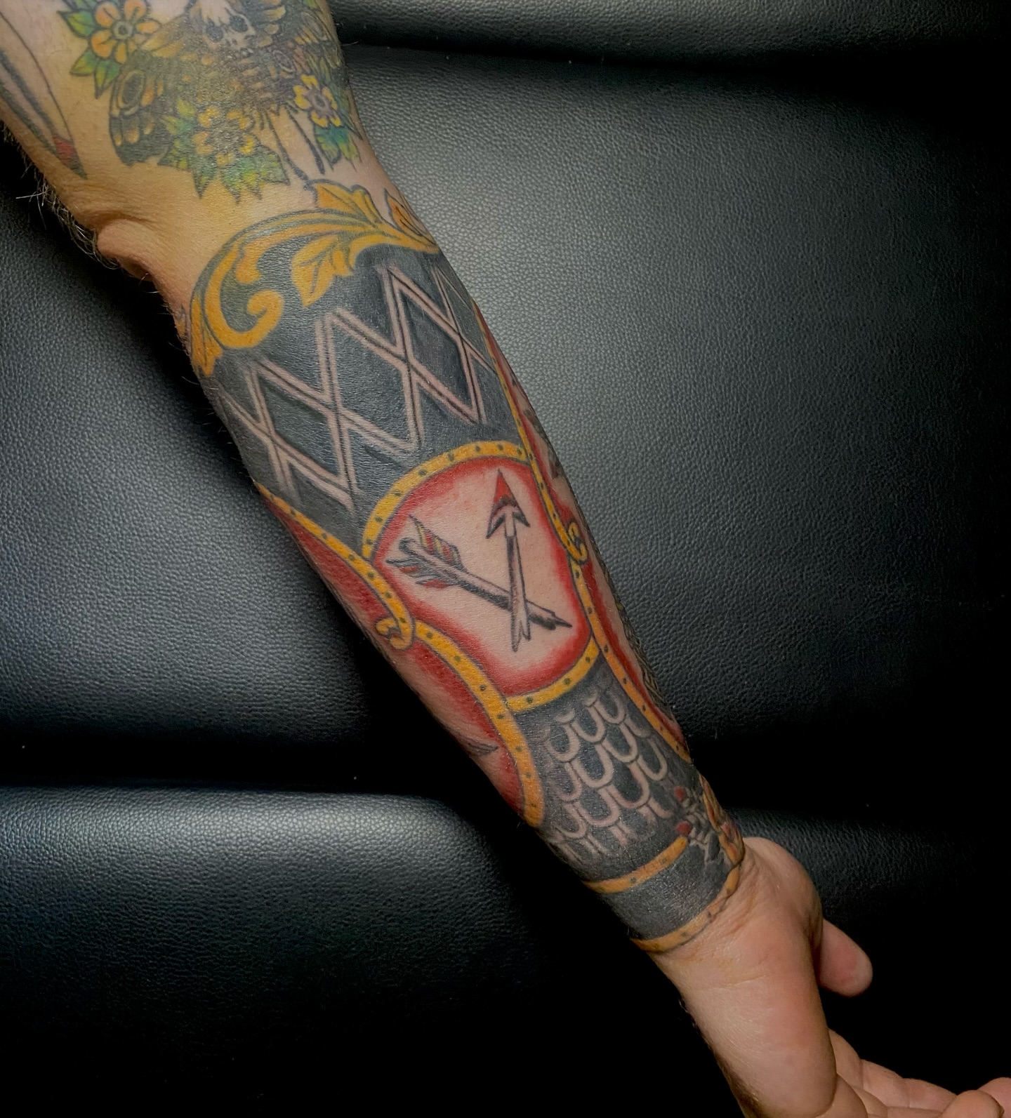 Arrow and shield geometric tattoo on the forearm by Giuseppe T.C.