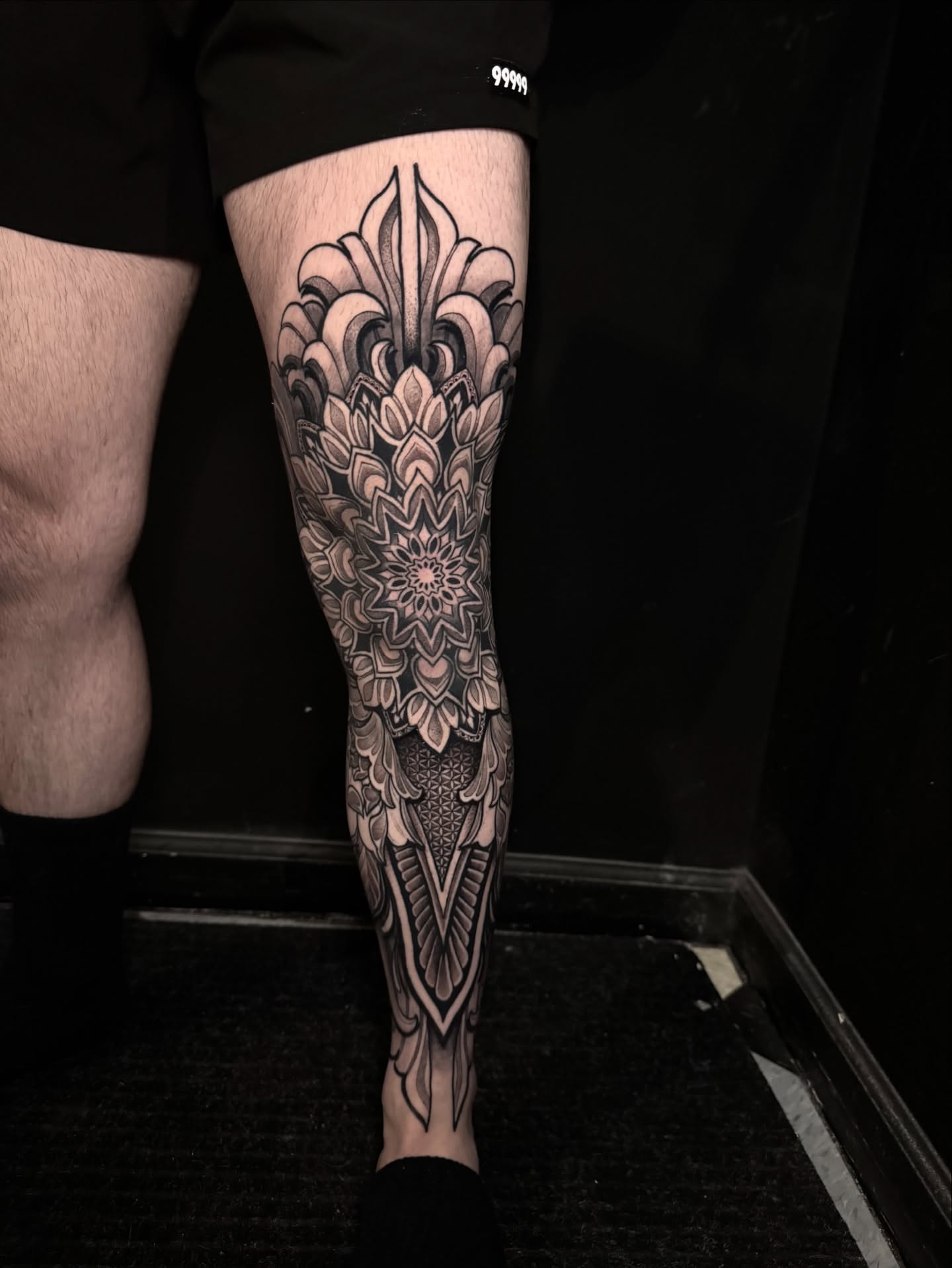 Mandala geometric tattoo on the calf by Caleb Gesicki