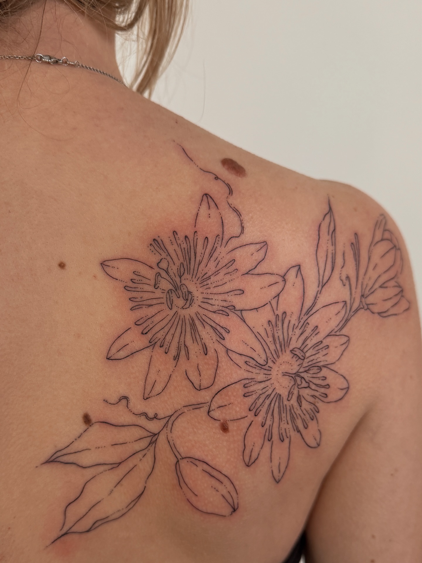 Passion flower black and grey tattoo on the shoulder by Inky Apricot, Austin, Texas
