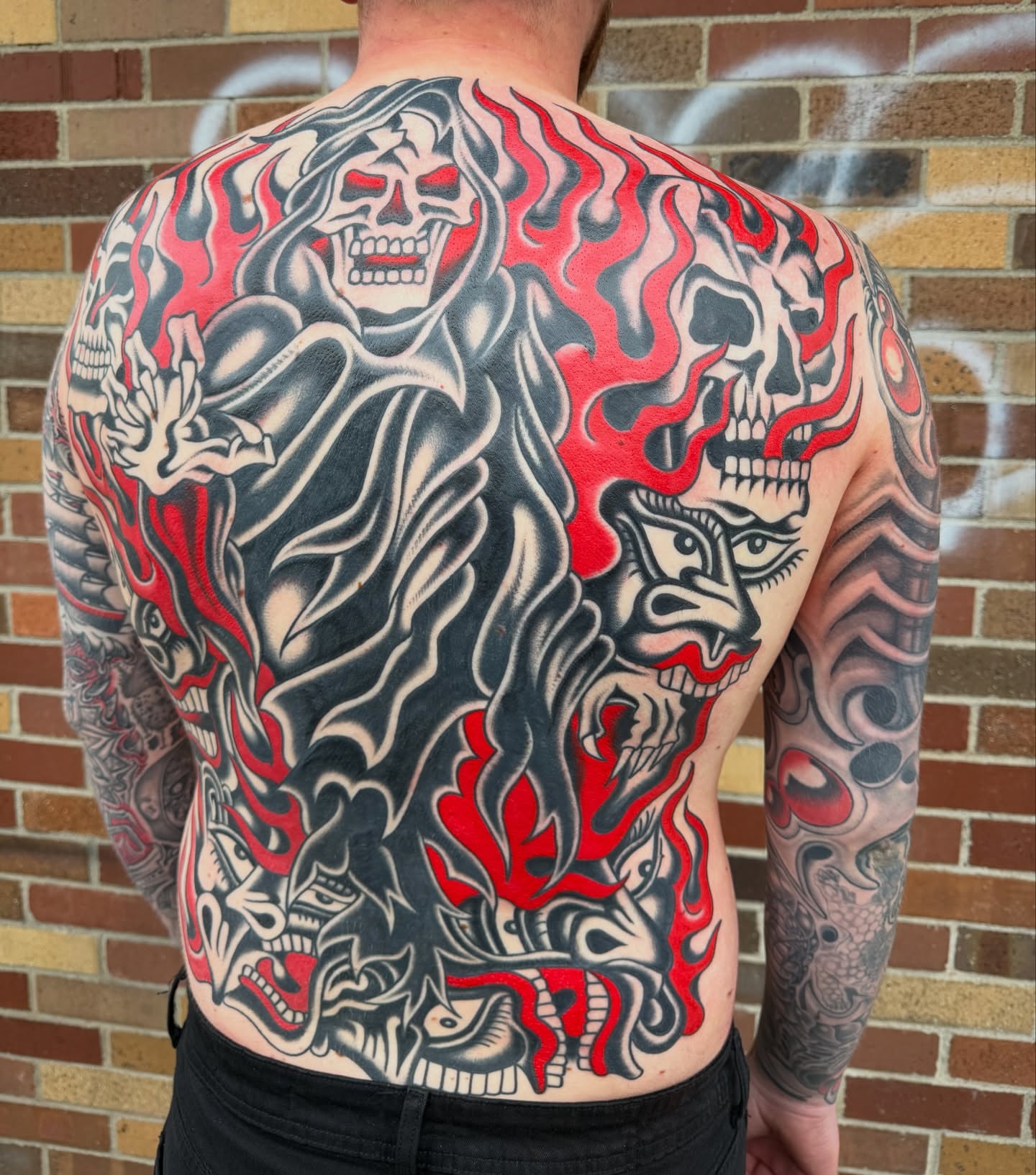 Grim reaper American traditional tattoo on the back by Nick Judkins Tattoo
