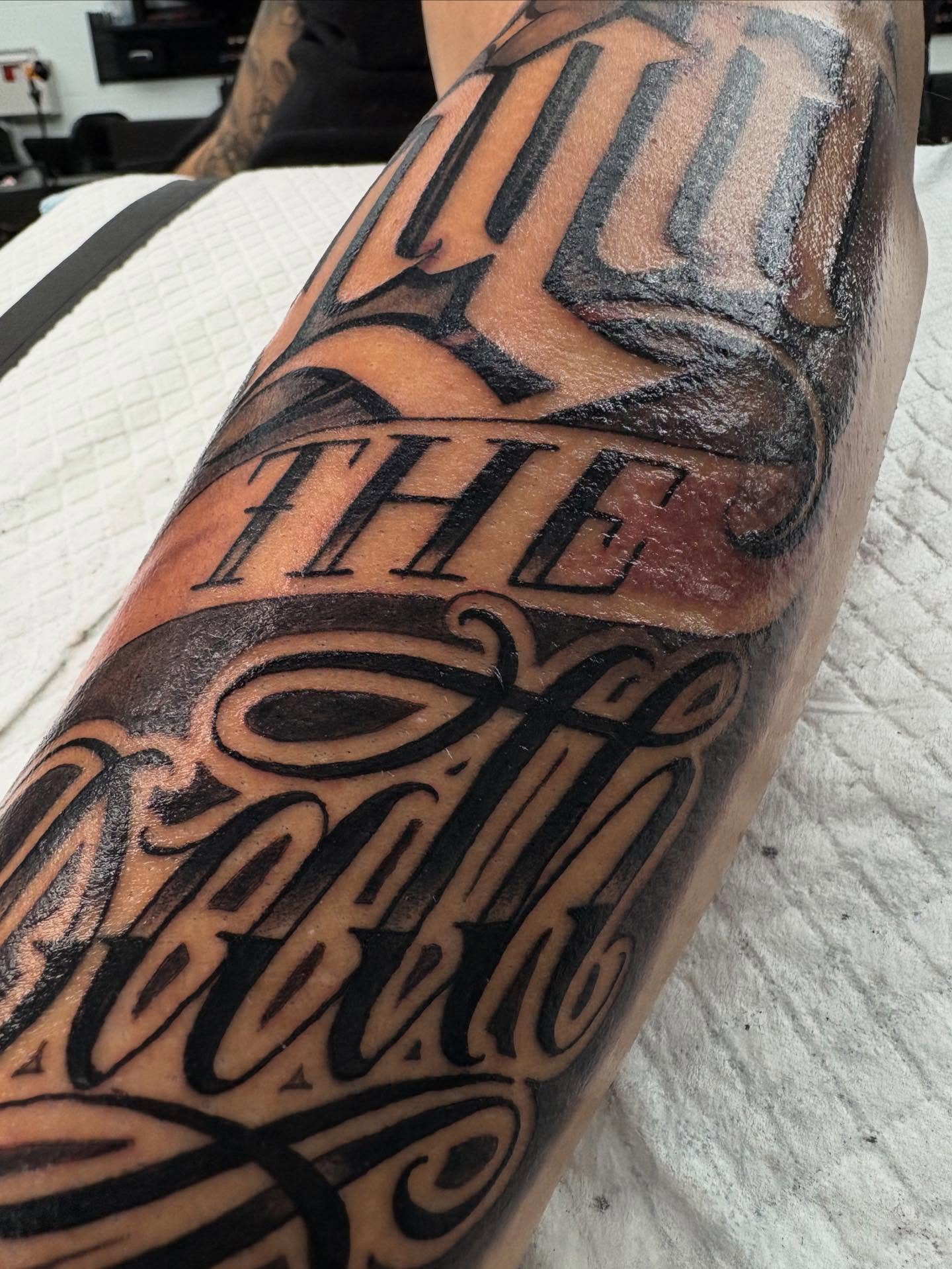 Out the circle lettering script tattoo on the forearm by Trusty Dizon Tattoo Artist
