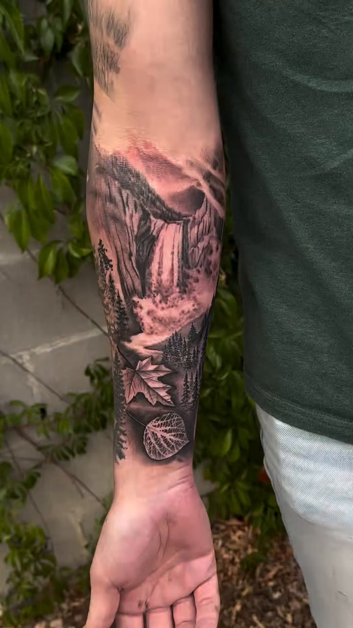 Mountain landscape with waterfall and trees realism tattoo by Jason Oz, Denver, Colorado