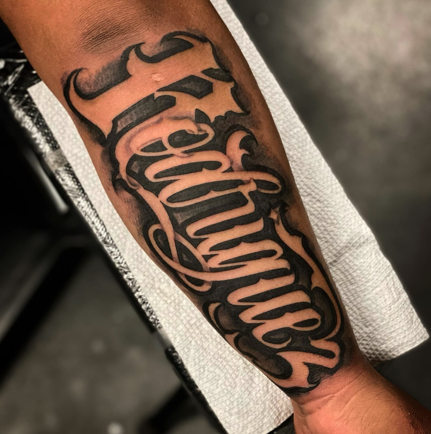 Script lettering lettering script tattoo on the forearm by Lex Miranda