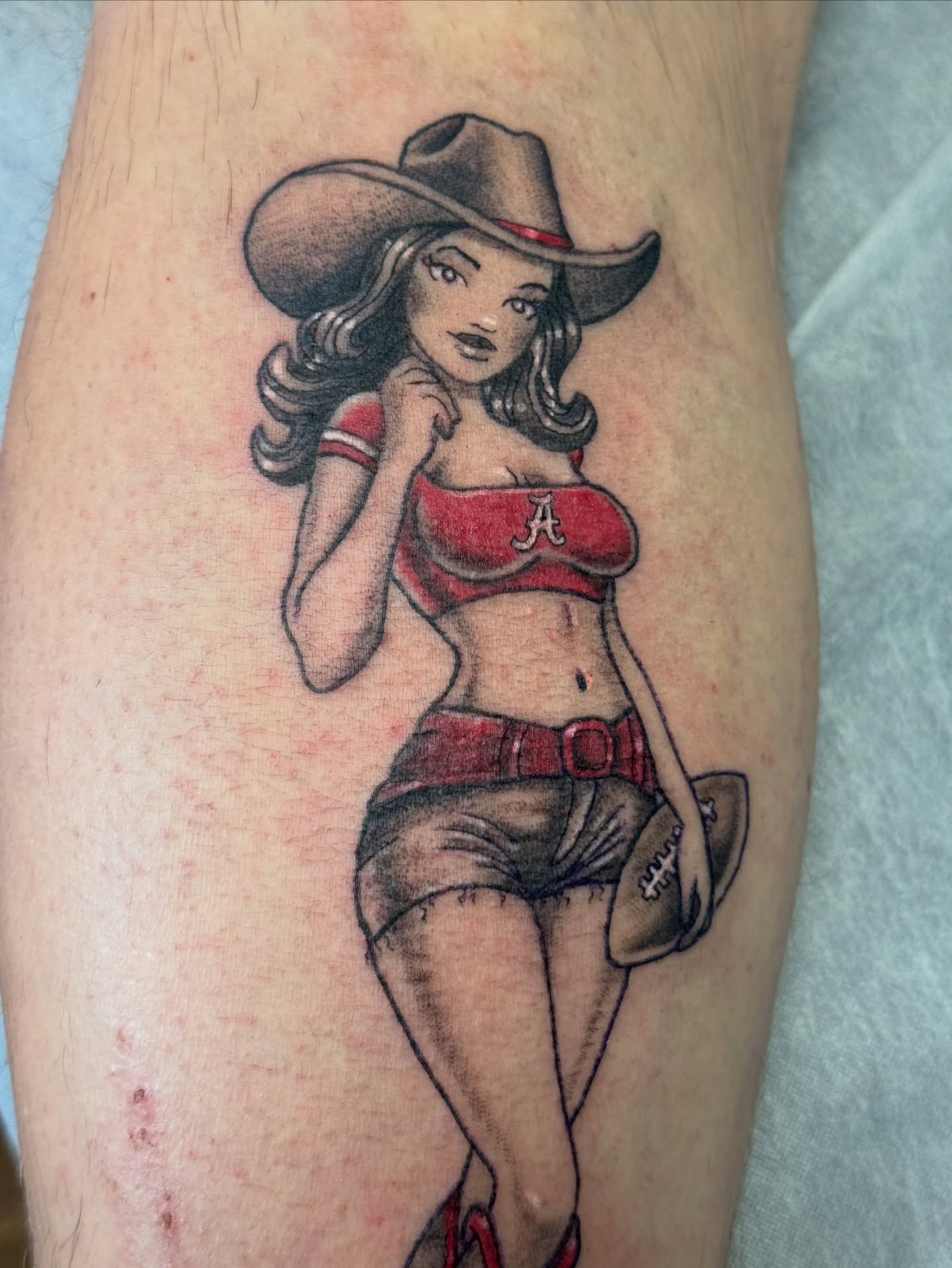 Cowgirl pin-up American traditional tattoo on the forearm by Bronzino Ink - Karen, Asheville, North Carolina