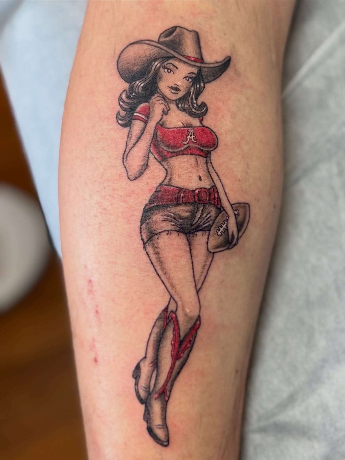 Cowgirl pin-up American traditional tattoo on the forearm by Bronzino Ink - Karen, Asheville, North Carolina
