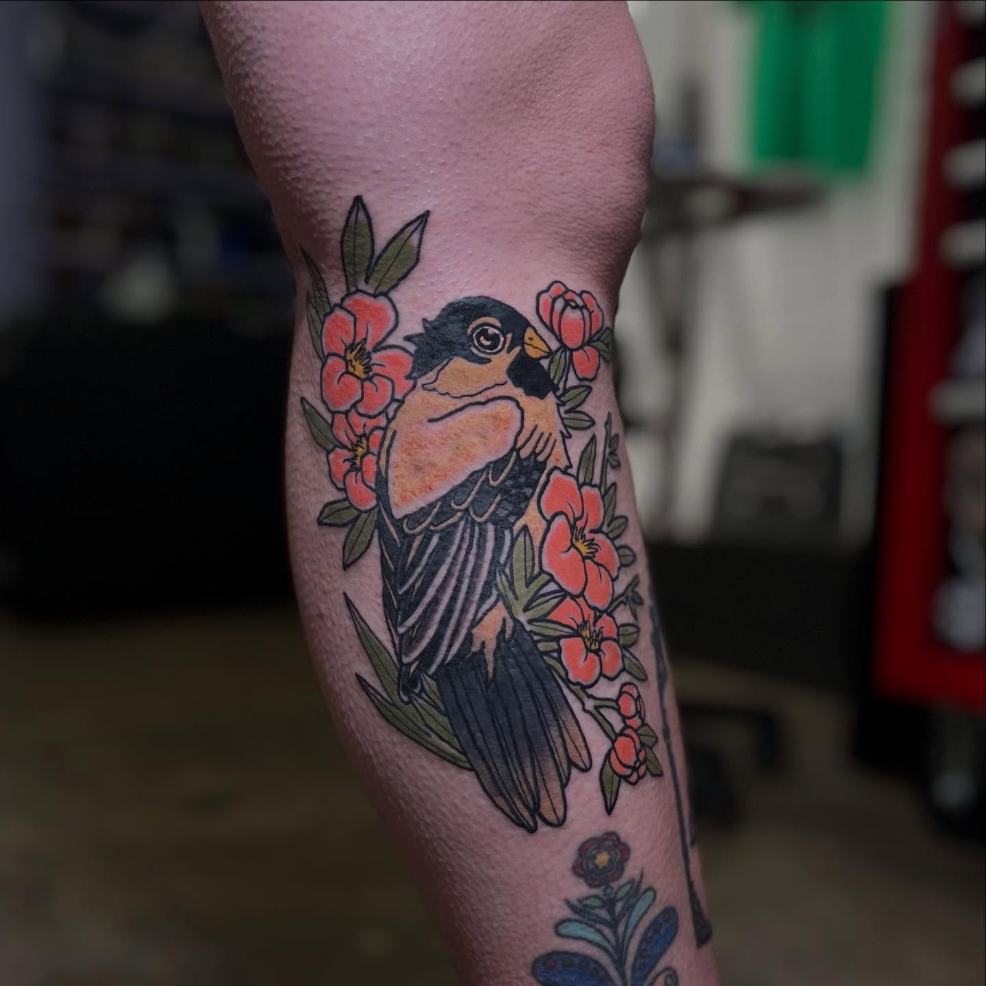 Bird with flowers American traditional tattoo on the forearm by Kaichi Fujita, Eugene, Oregon