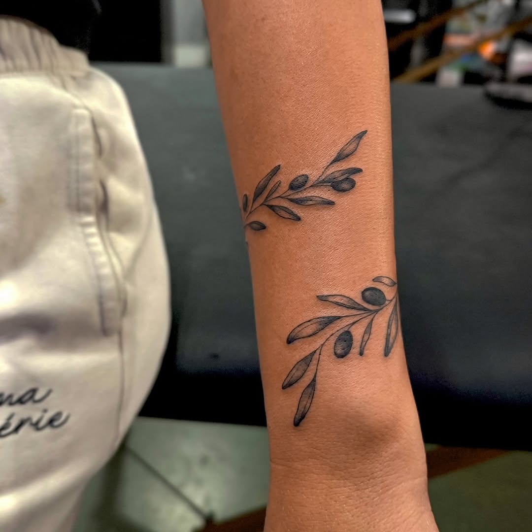Olive branches ornamental tattoo on the forearm by Dee, San Diego, California