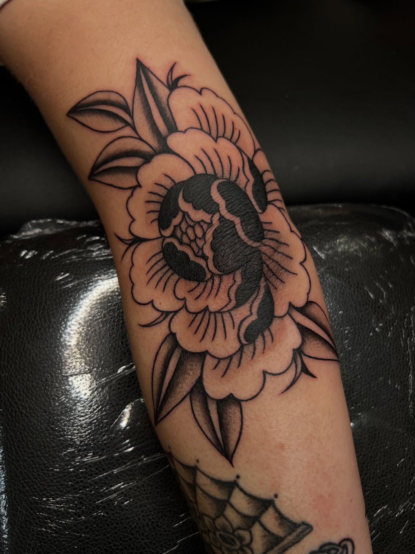 Peony American traditional tattoo on the forearm by @syrenbier, San Francisco, California