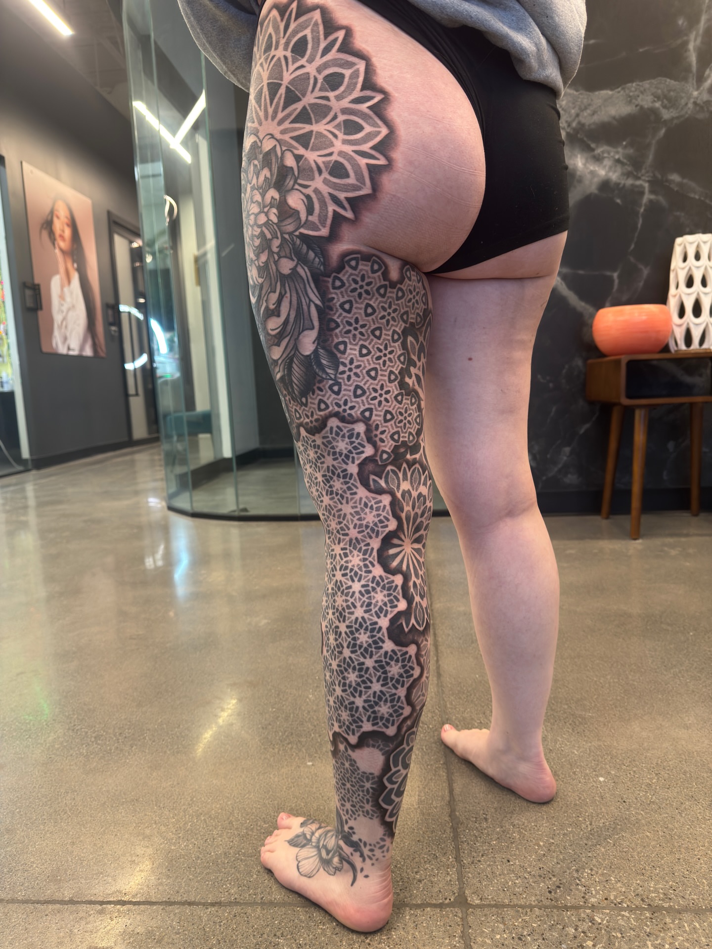 Geometric floral pattern geometric tattoo on the leg by Christofer Irvin