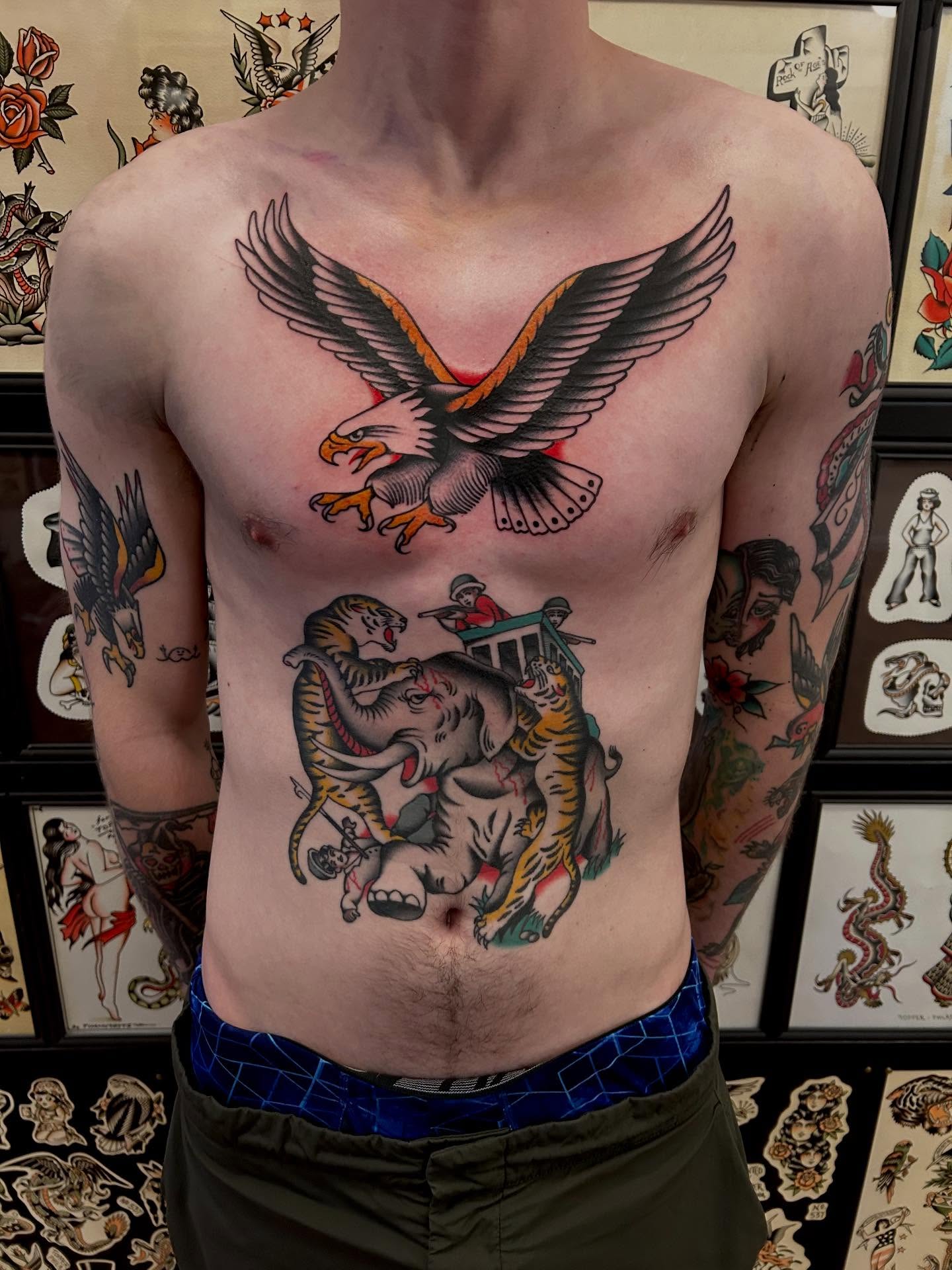 Elephant and tiger American traditional tattoo on the torso by Christian Lasyone
