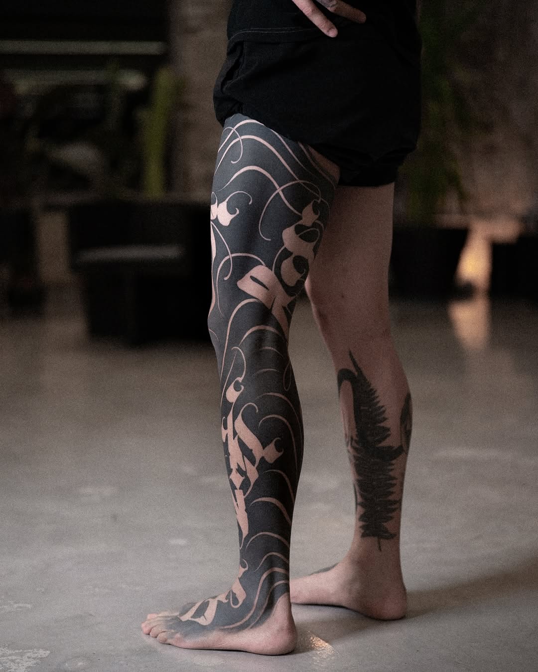 Abstract ornamental leg sleeve Japanese tattoo on the leg by Low, Brooklyn, New York