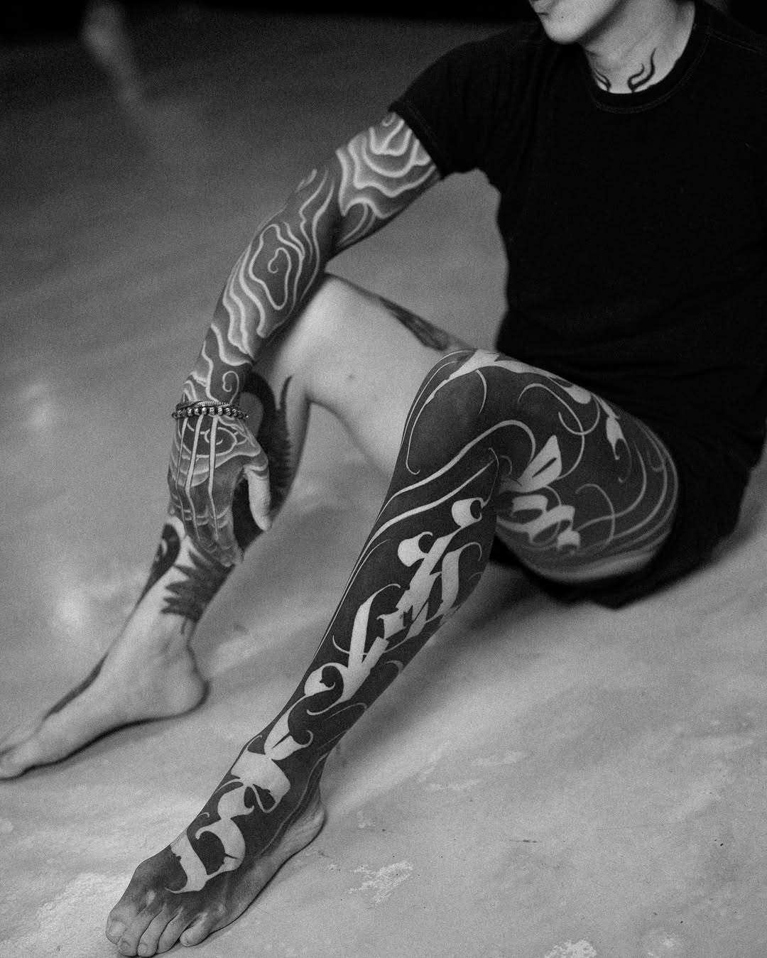 Calligraphy script Japanese tattoo on the leg by Low, Brooklyn, New York