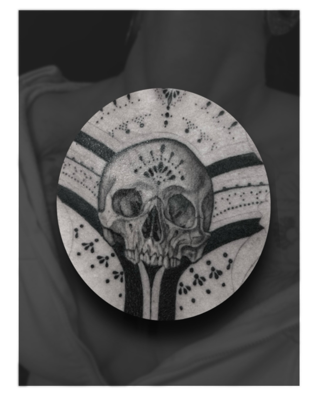 Skull dotwork tattoo on the chest by Jordyn Tinney