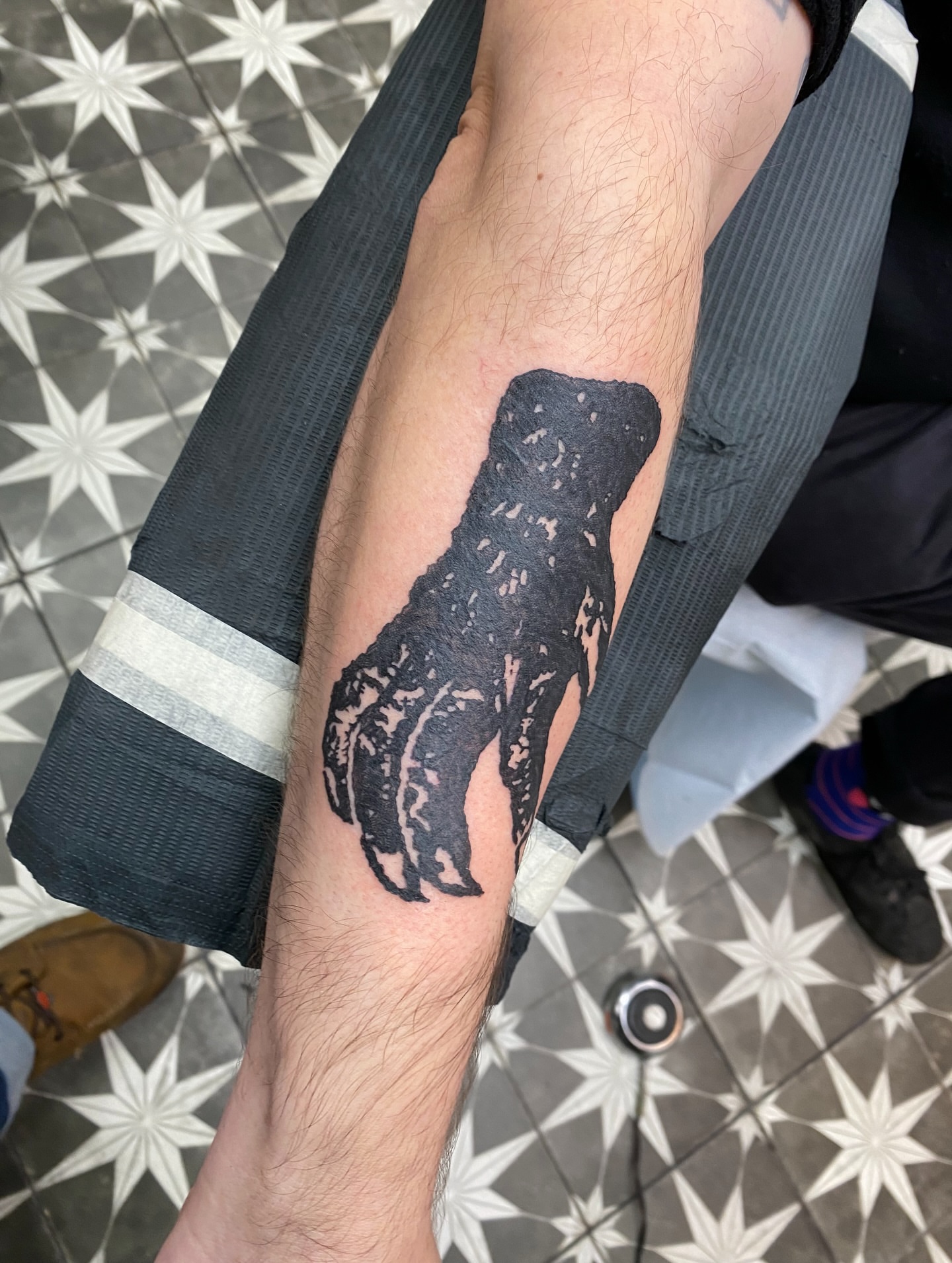 Lobster black and grey tattoo on the forearm by Mike Tapia