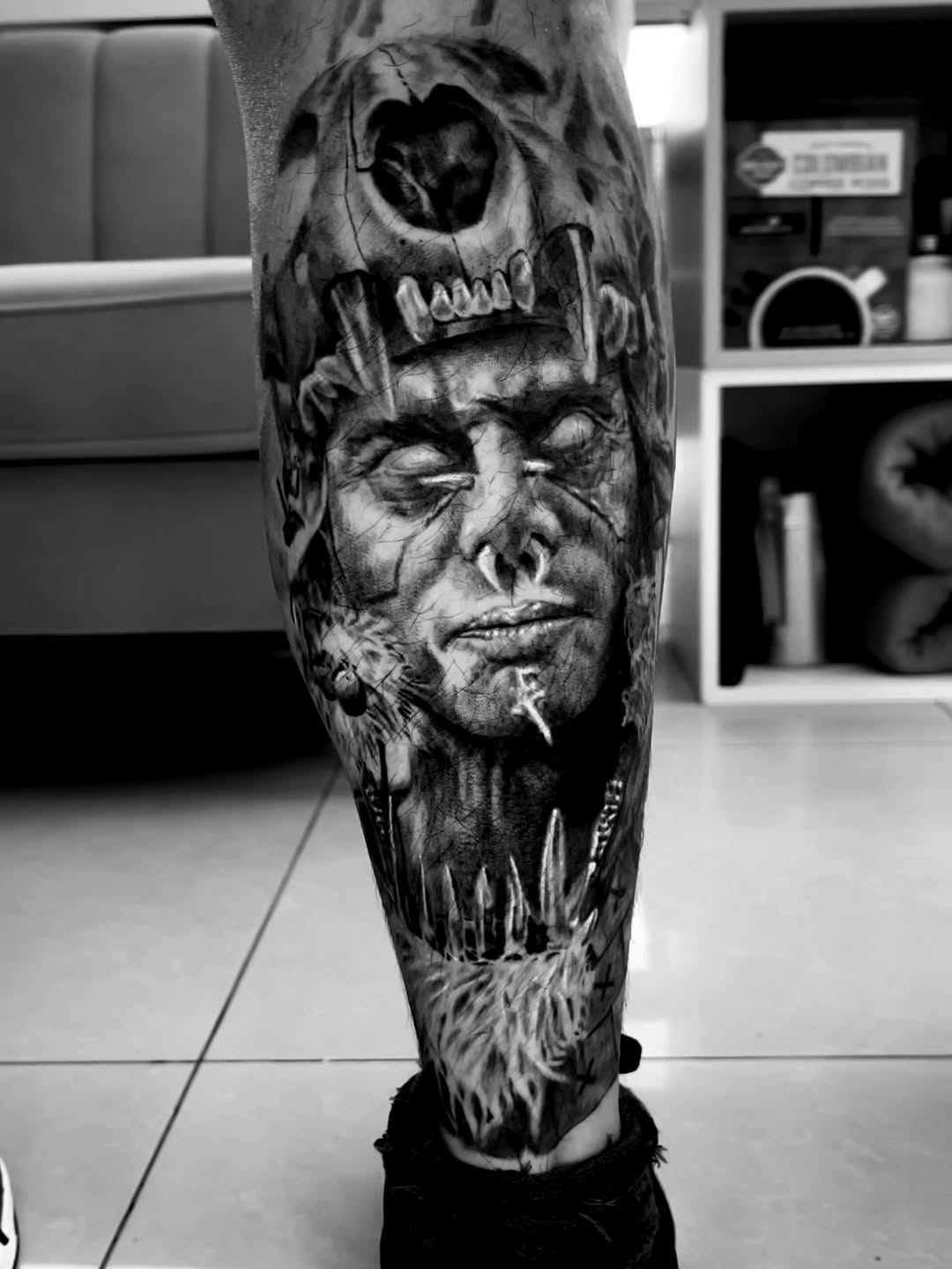 Man with animal skull headdress realism tattoo on the forearm by Tattoo Artist