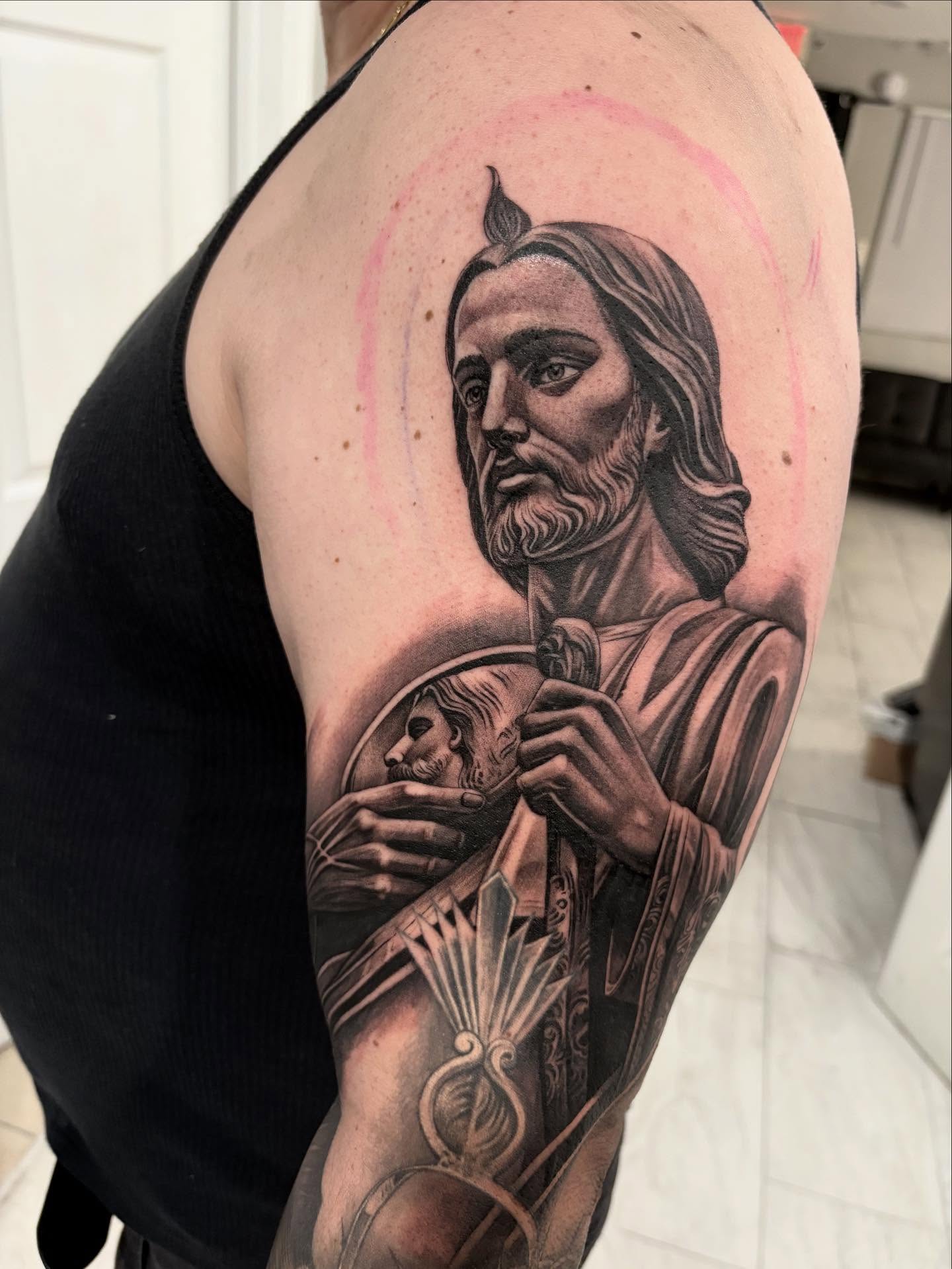 Religious figure realism tattoo on the shoulder by Juan Lira