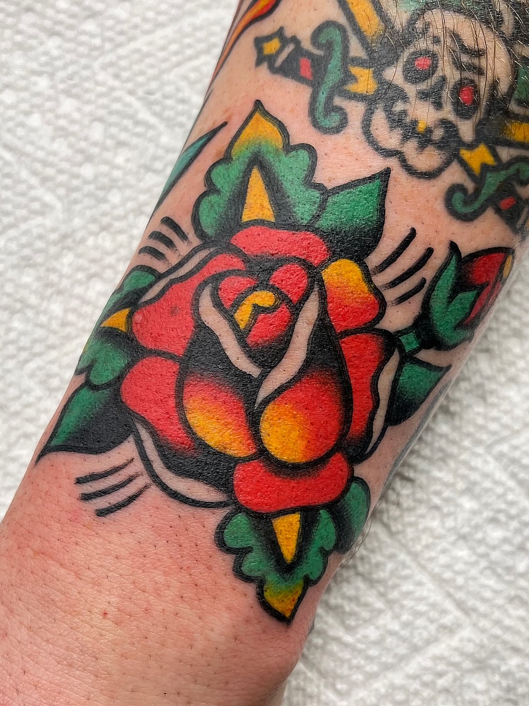 Rose American traditional tattoo on the forearm by π΅ππππ π¬ππππ