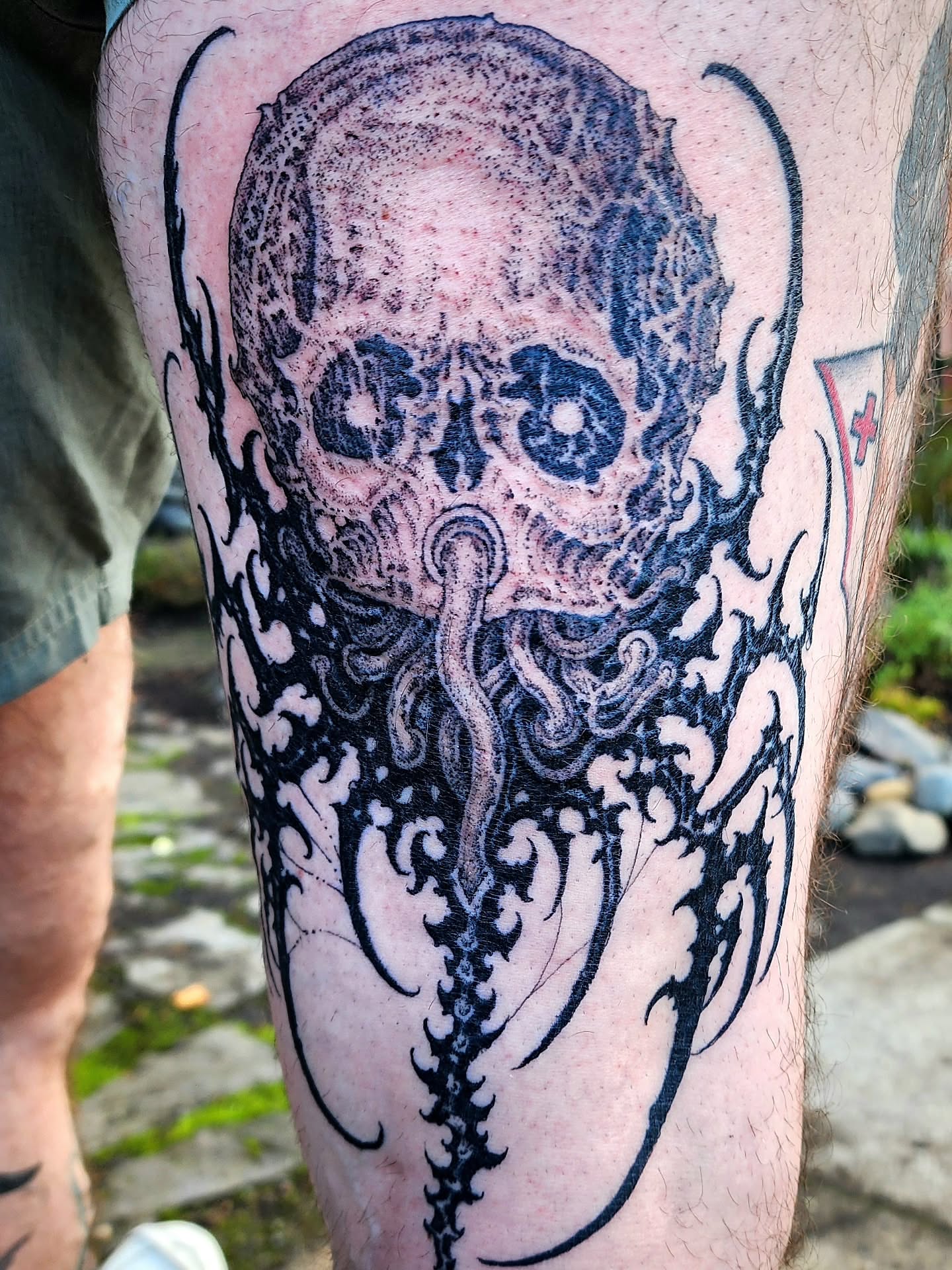 Skull with tentacles dark realism tattoo on the forearm by @hellscribe