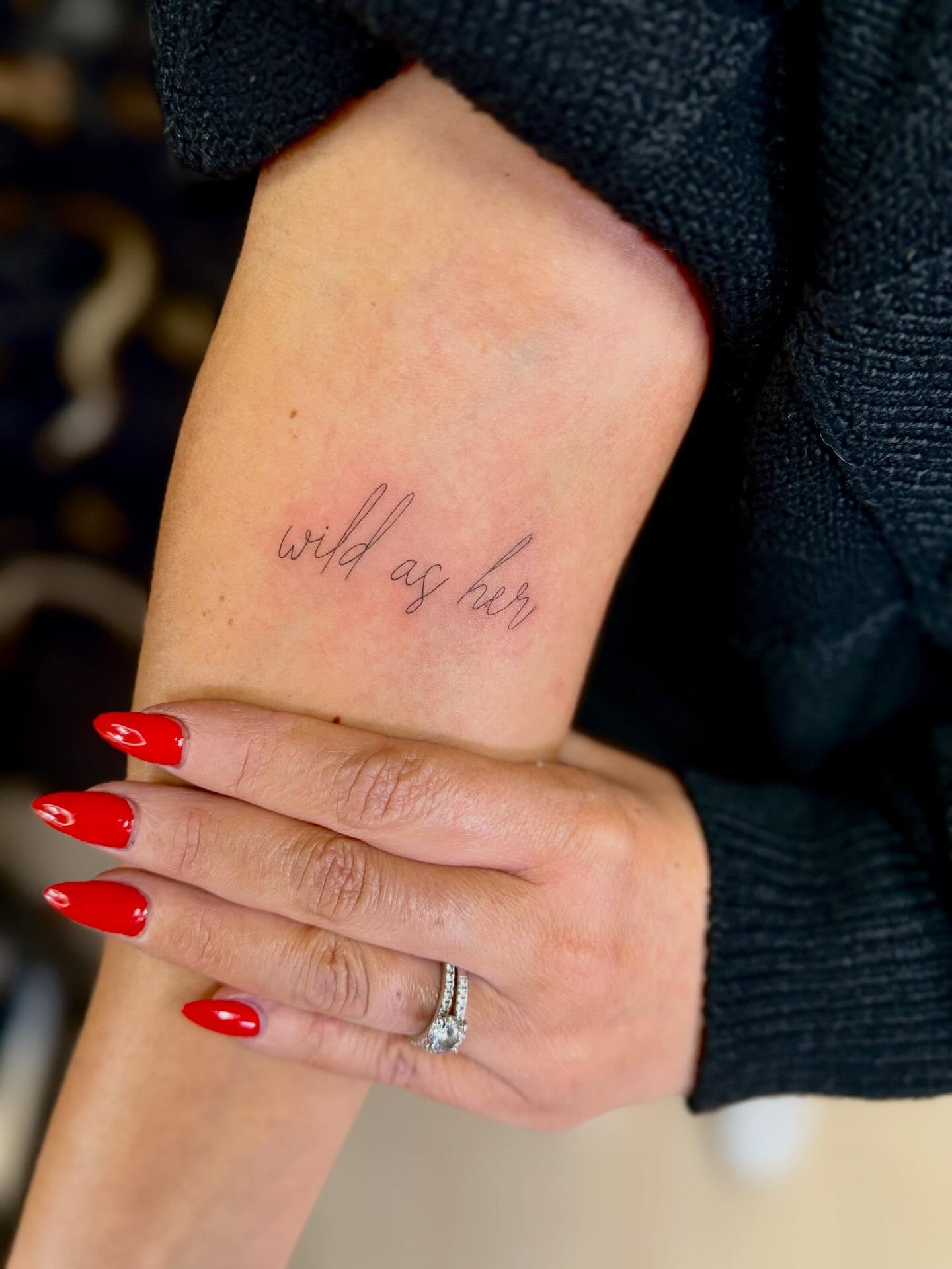 Wild as her lettering script tattoo on the forearm by Fineline Tattoos π€ Hailey L.