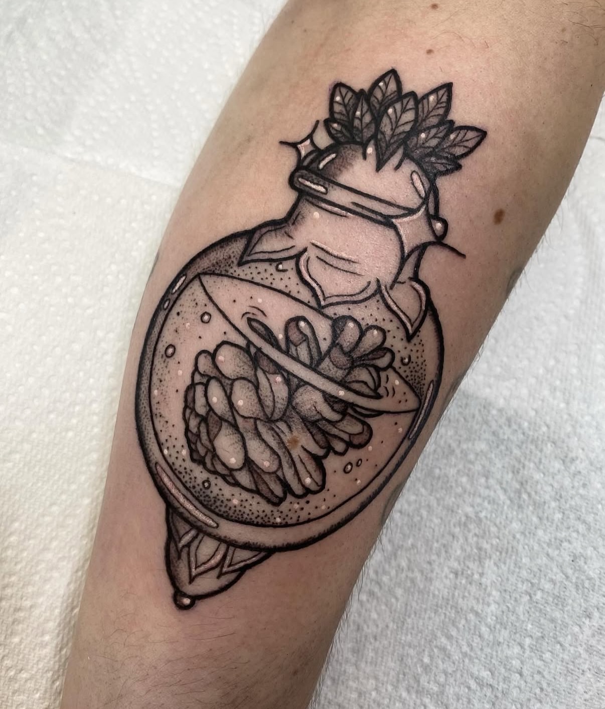 Pinecone dotwork tattoo on the forearm by Poppy Olivia Deards