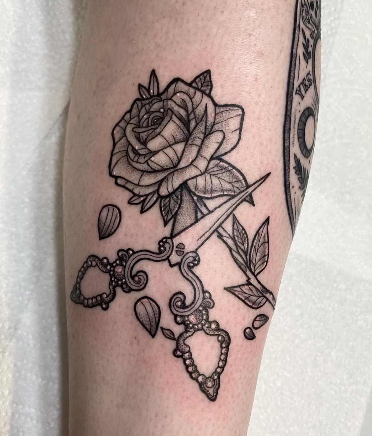 Rose and dagger dotwork tattoo on the forearm by Poppy Olivia Deards
