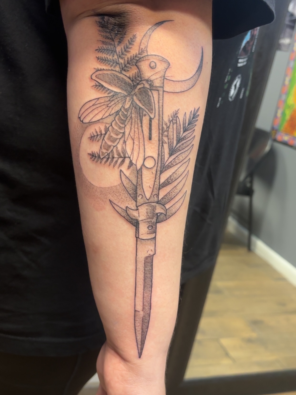 Insect and dagger dotwork tattoo on the forearm by ✨Cyerra Lynne✨