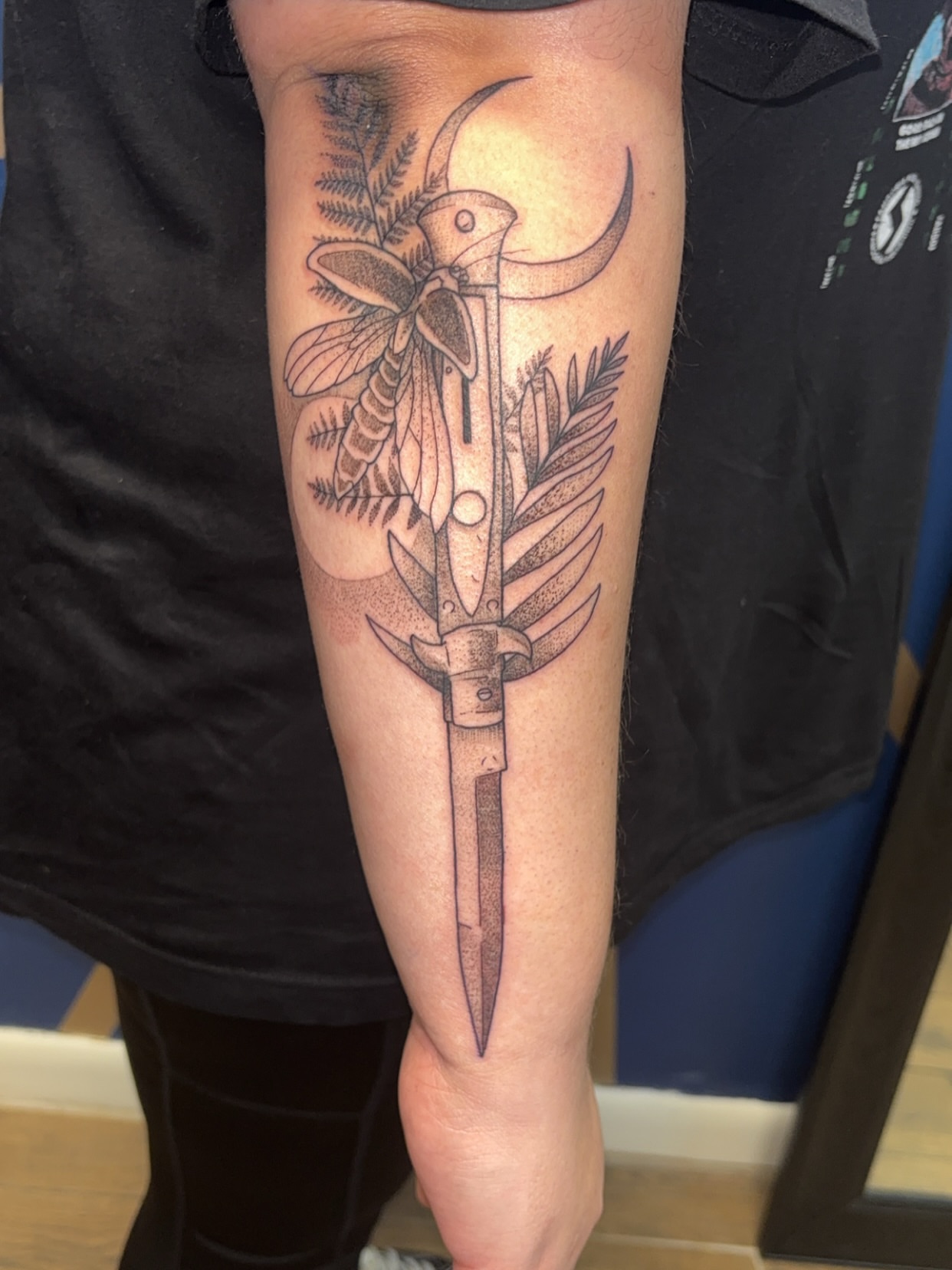 Knife and feathers realism tattoo on the forearm by ✨Cyerra Lynne✨
