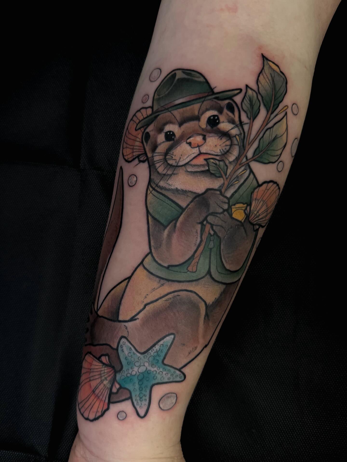 Otter with hat new school tattoo on the forearm by Hades cabrera, Richmond, Virginia
