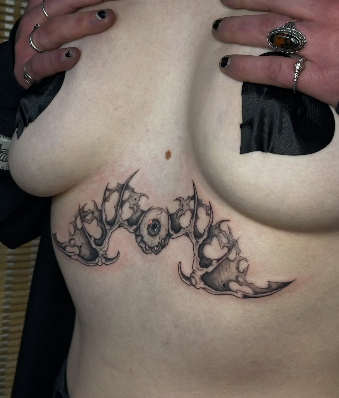 Antlers and skull black and grey tattoo on the chest by father