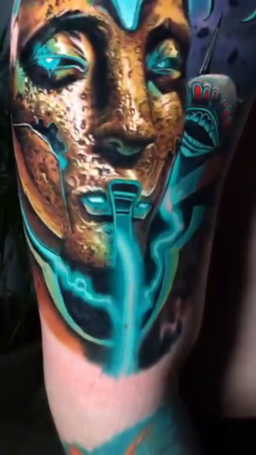 Medusa head with glowing blue energy realism tattoo by Sean Foy