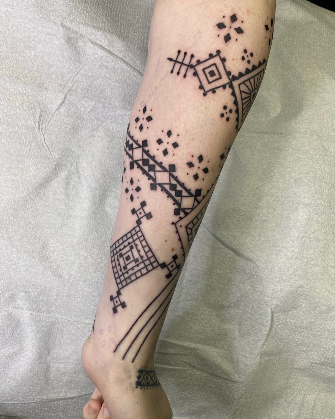 Geometric pattern geometric tattoo on the forearm by Dave Rodriguez